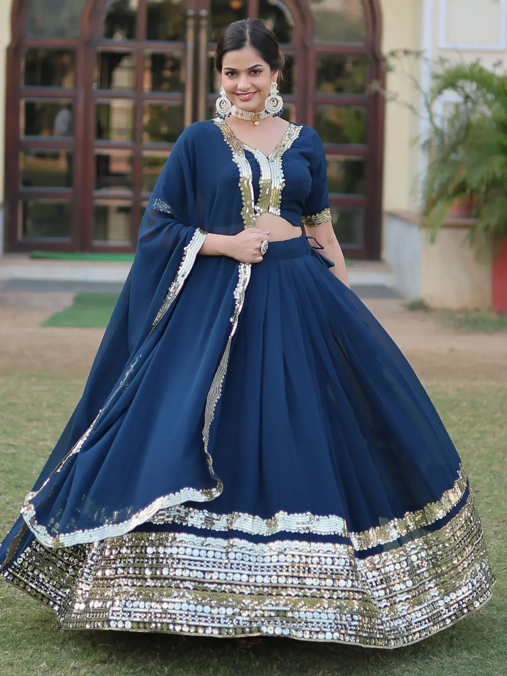 Navy blue designer lehenga choli with gold and silver embroidery, perfect for Indian ethnic wear events