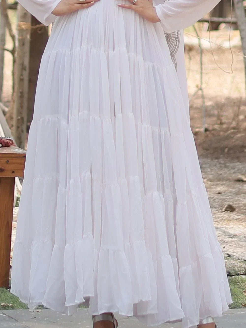 White tiered Anarkali gown with flowy pleats and flared hem for women