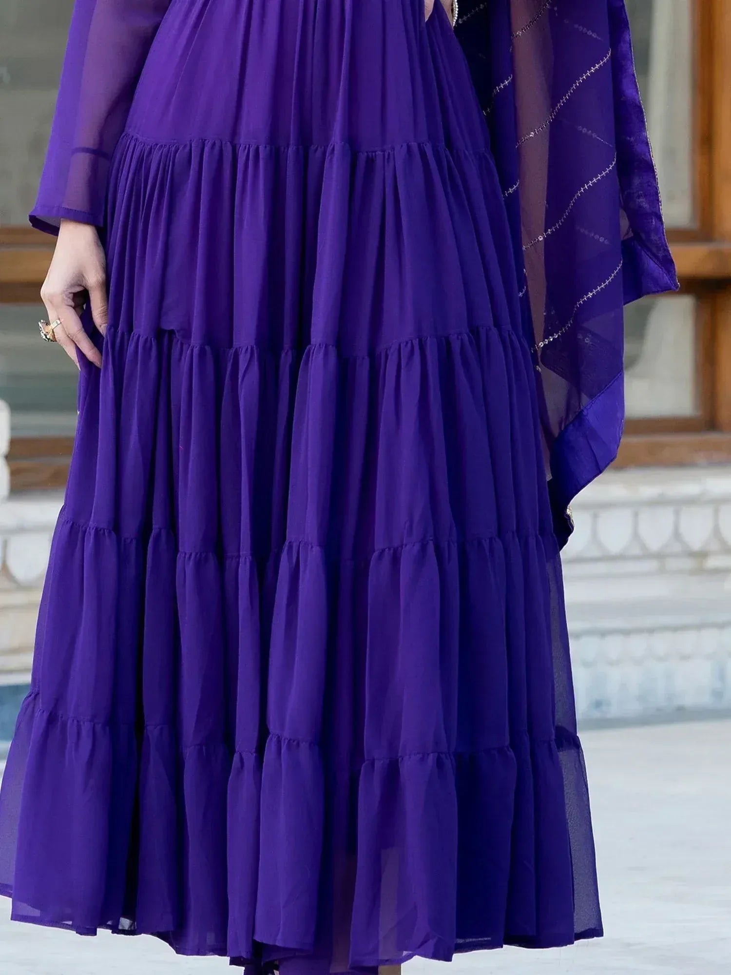 Purple tiered ethnic gown with sheer sleeves and matching dupatta
