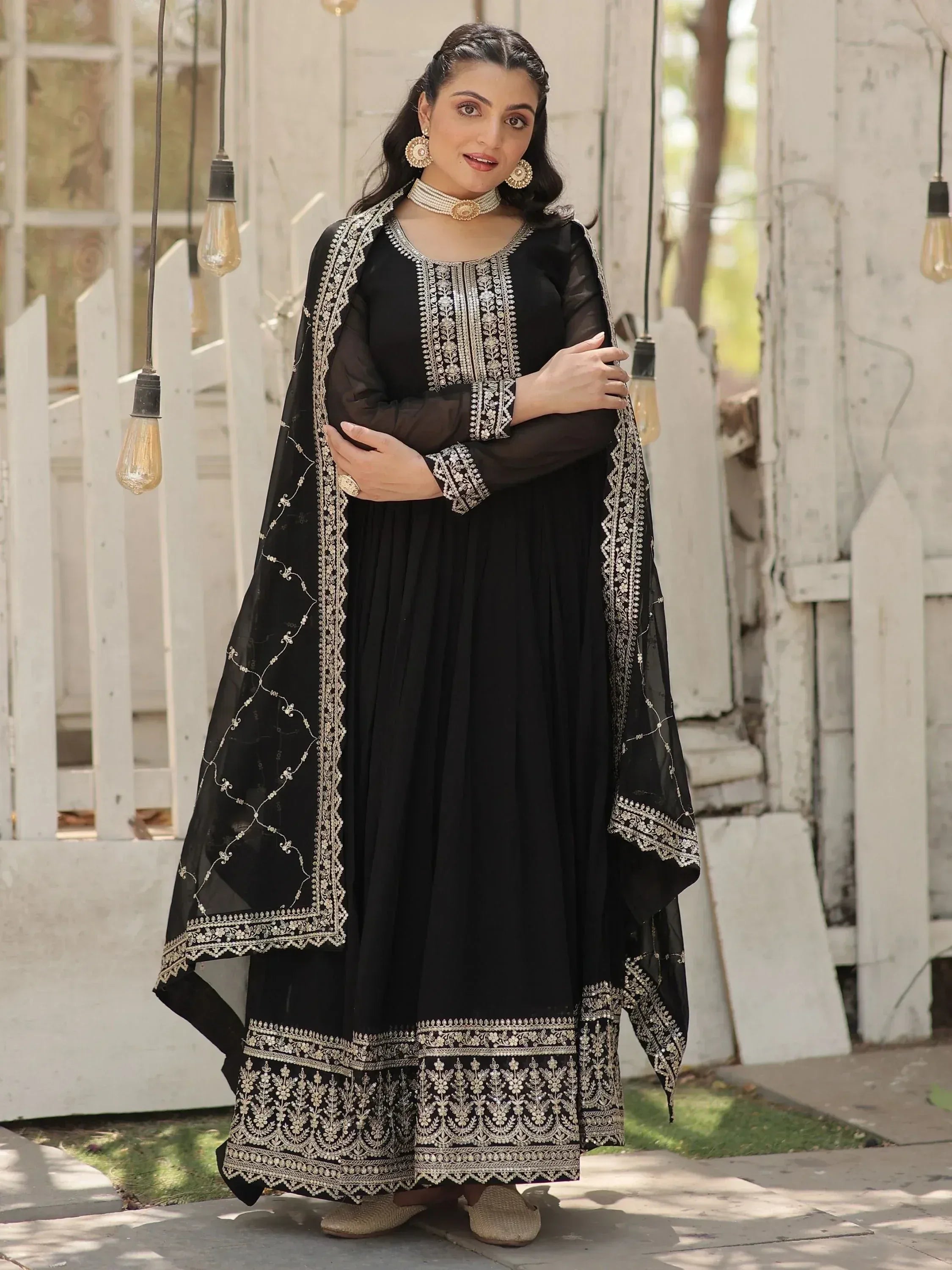 Black embroidered anarkali suit with gold detailing, perfect for Indian ethnic wear occasions.