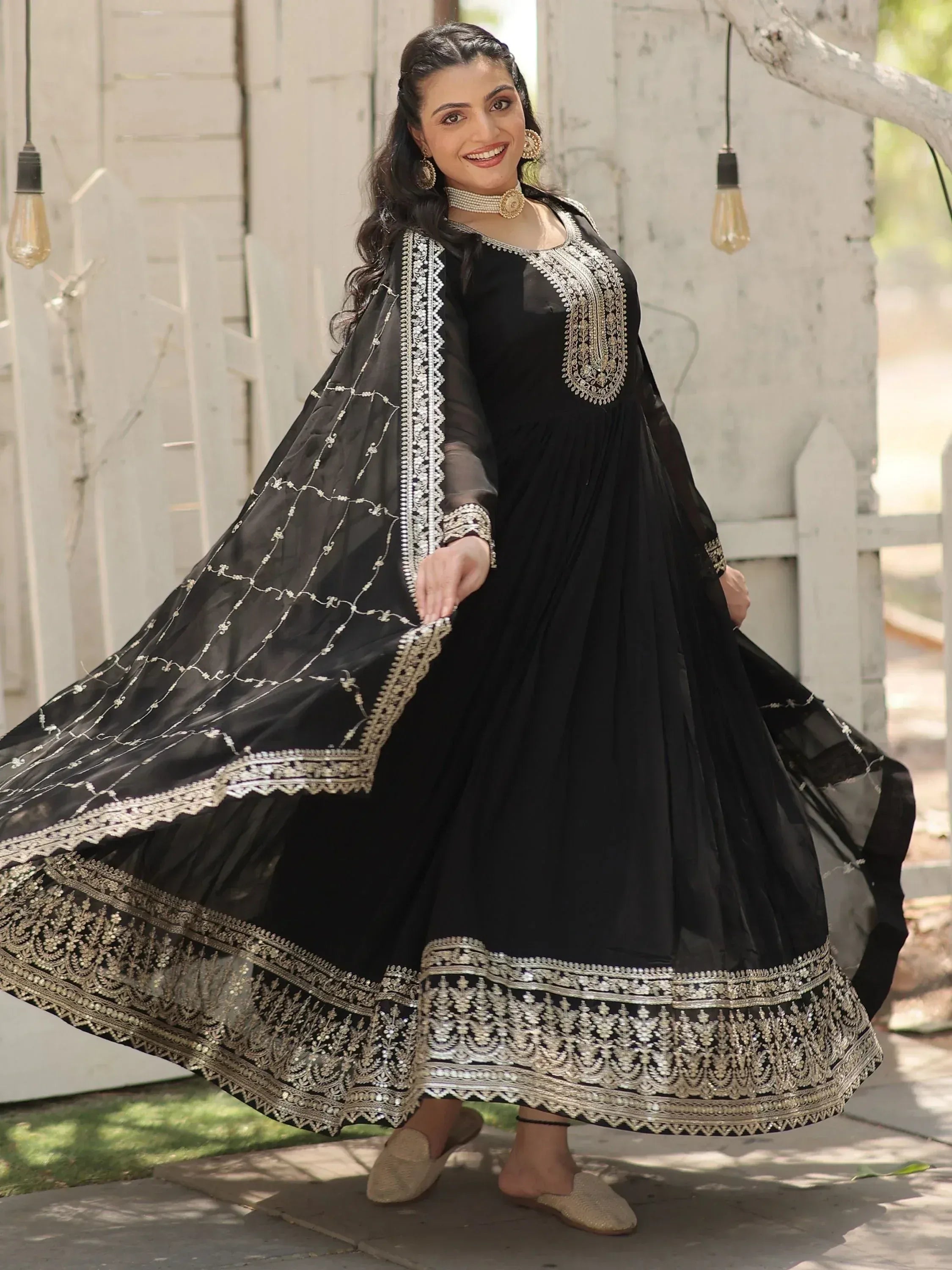 Black embroidered anarkali suit with gold detailing, perfect for Indian ethnic wear occasions.