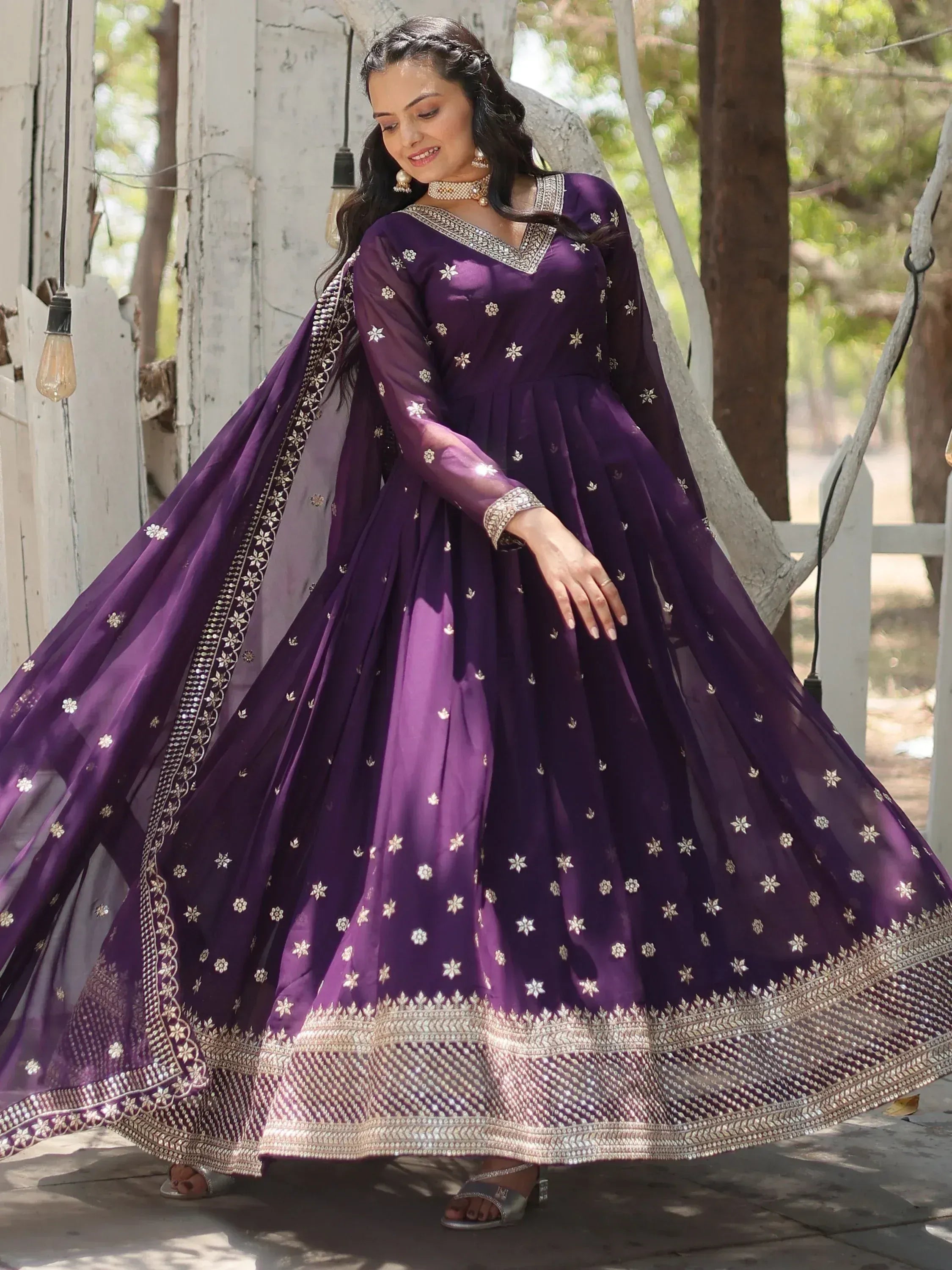 Purple embroidered anarkali gown with gold floral motifs and dupatta, perfect for Indian ethnic occasions