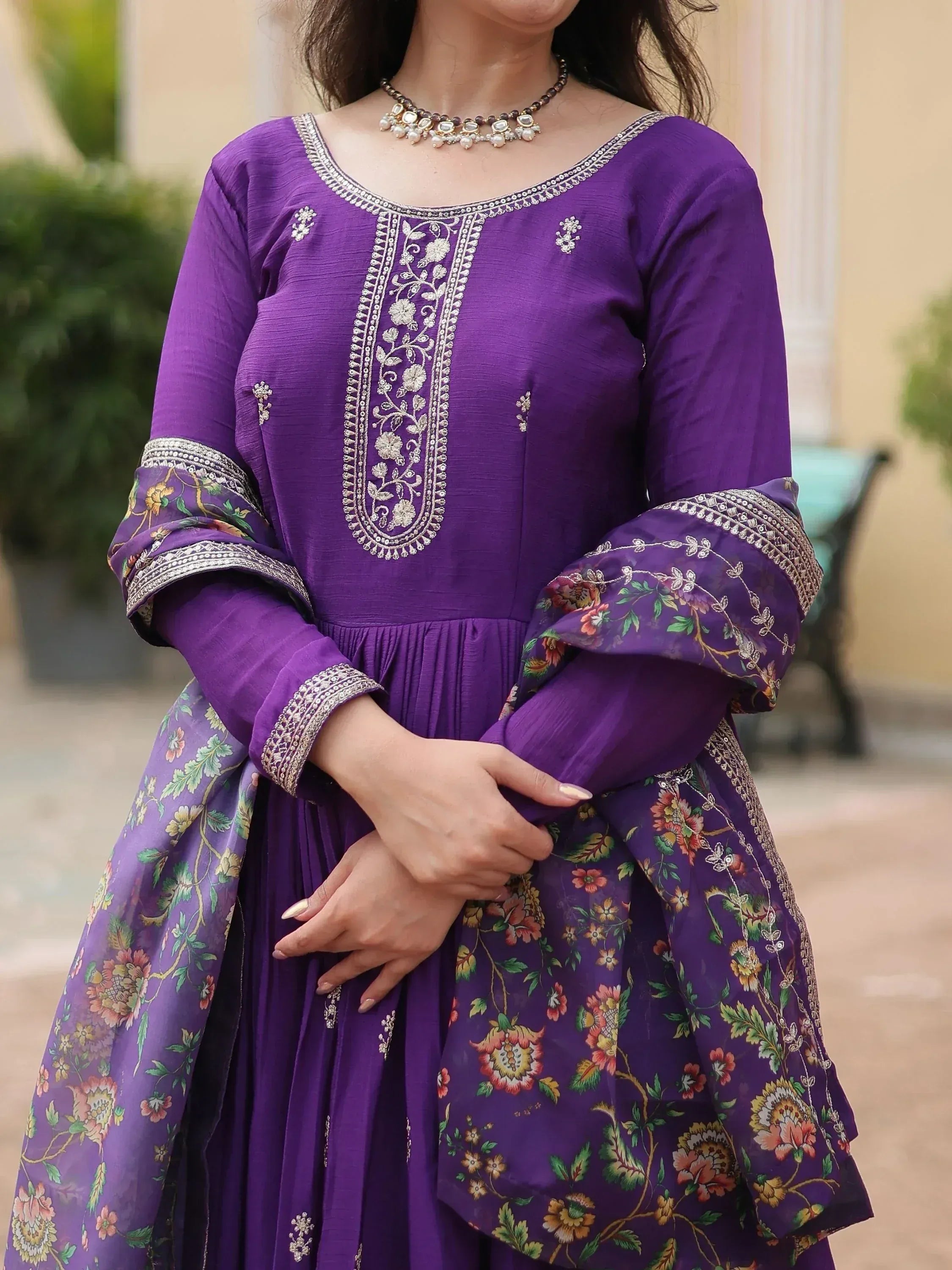 Purple embroidered ethnic gown with floral dupatta and silver necklace