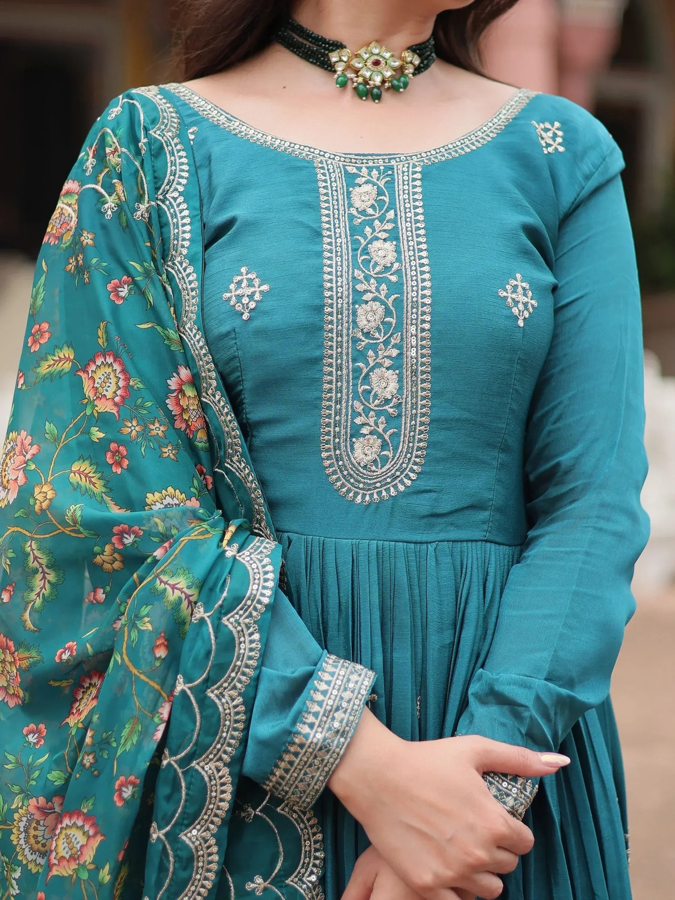Teal Indian ethnic gown with floral print dupatta and silver embroidery, paired with green beaded choker