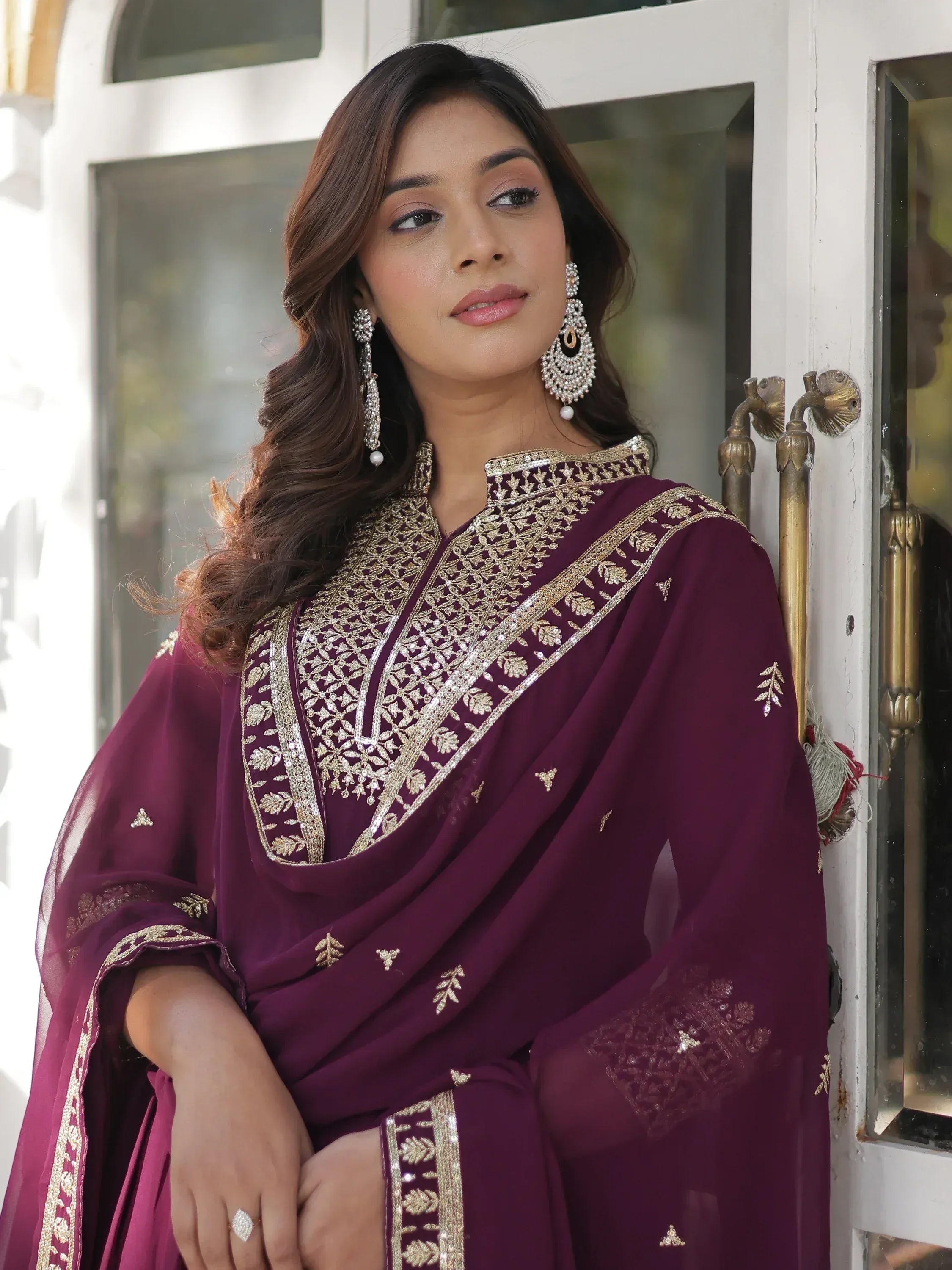 Elegant maroon salwar kameez with gold embroidery, perfect for Indian ethnic wear occasions.
