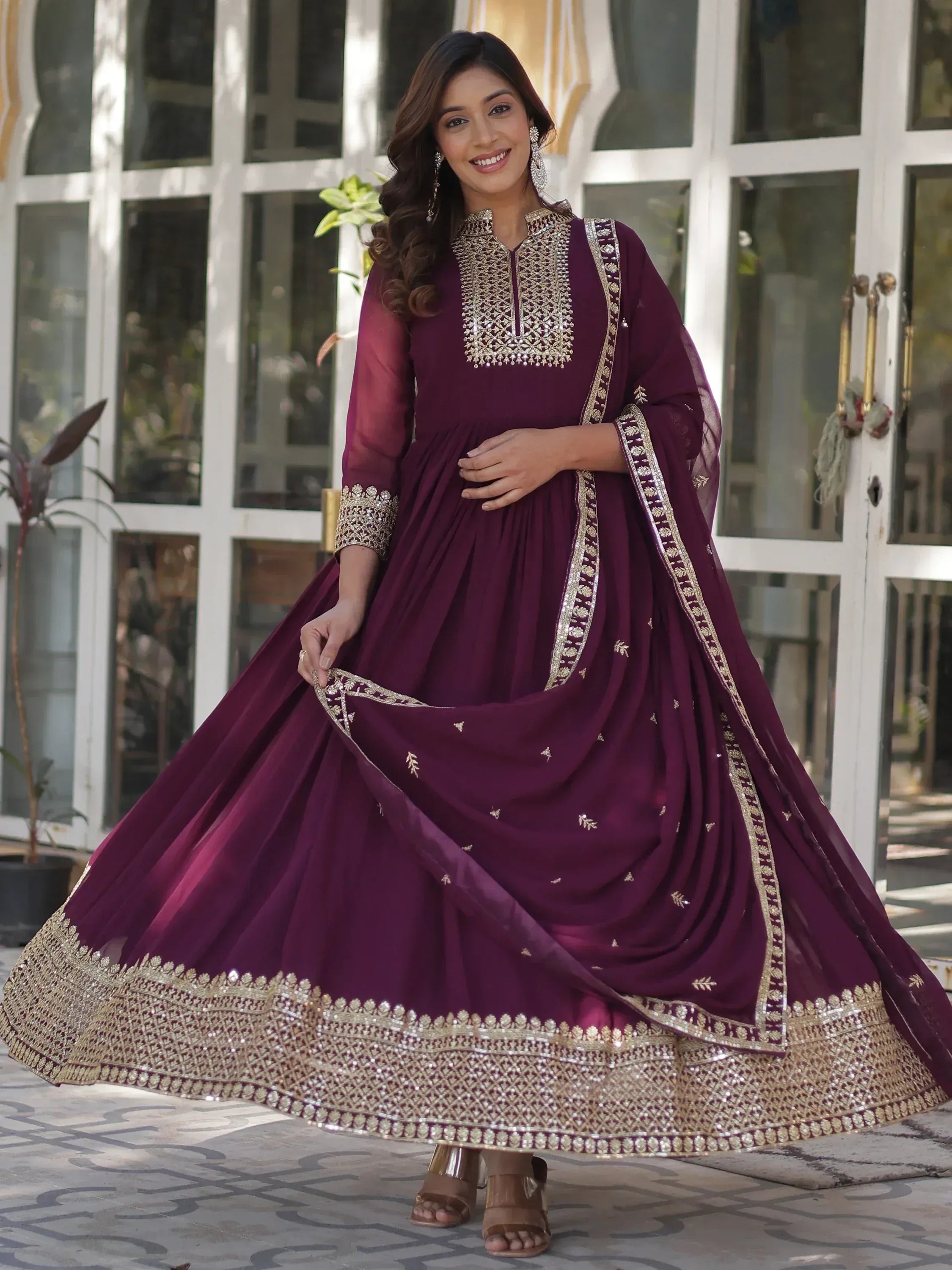 Elegant maroon anarkali suit with gold embroidery, perfect for Indian ethnic wear occasions.