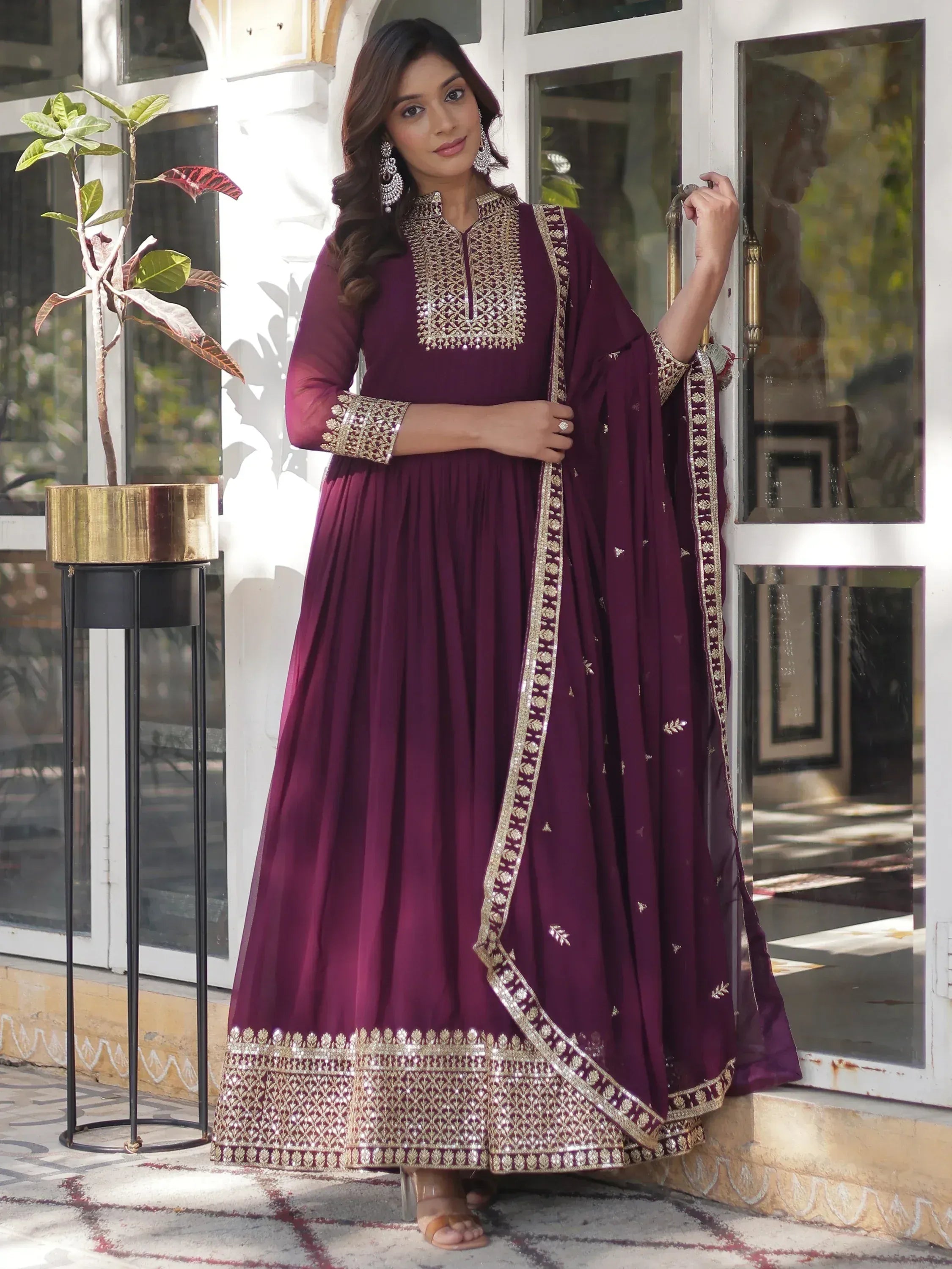 Elegant maroon anarkali with gold embroidery, perfect for Indian ethnic wear occasions.