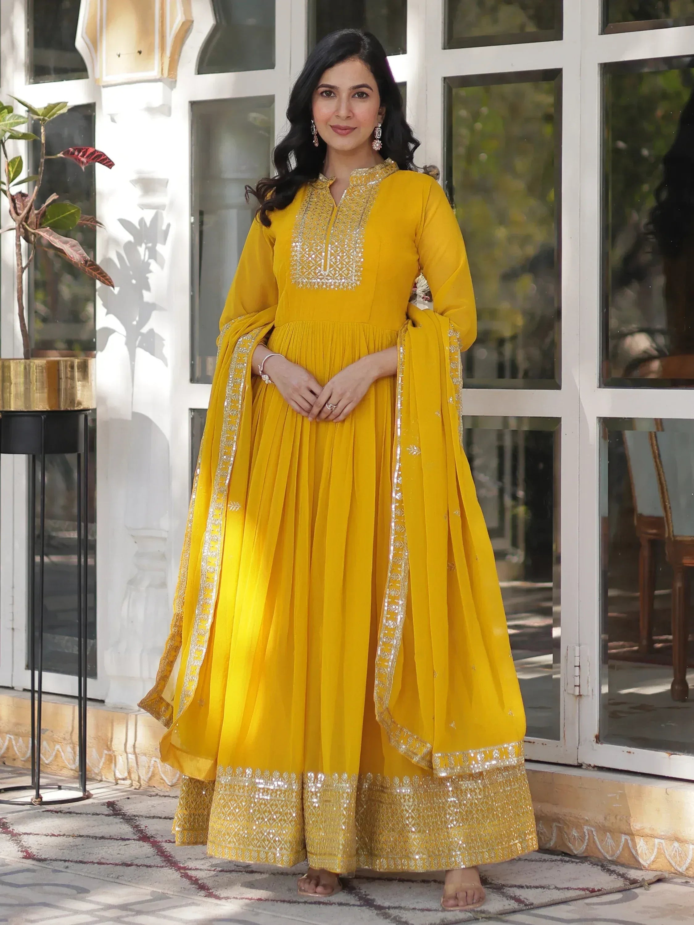 Yellow ethnic anarkali suit with silver embroidery and pleated skirt
