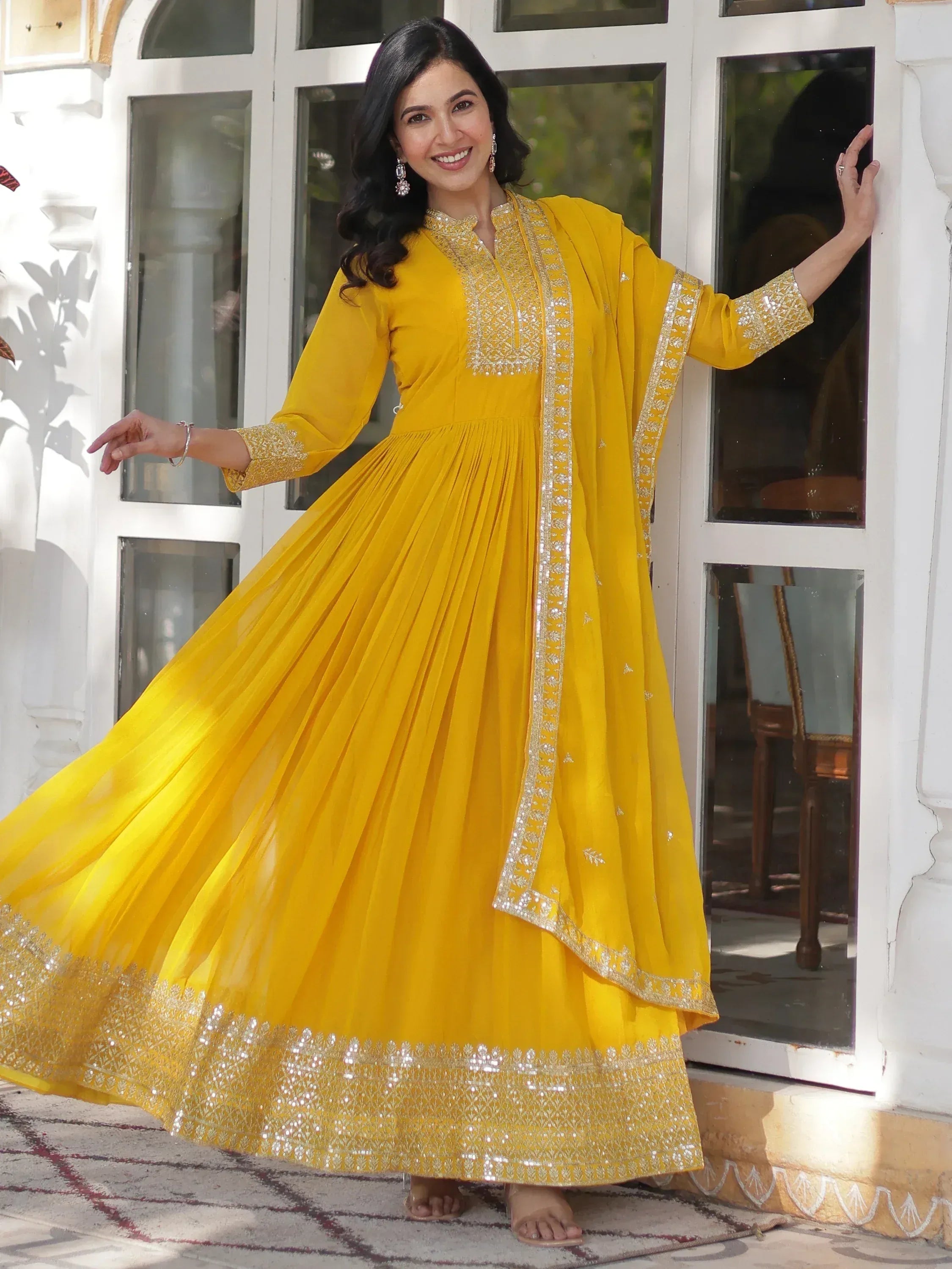 Yellow ethnic anarkali gown with silver embroidery, perfect for Indian festive occasions and weddings.