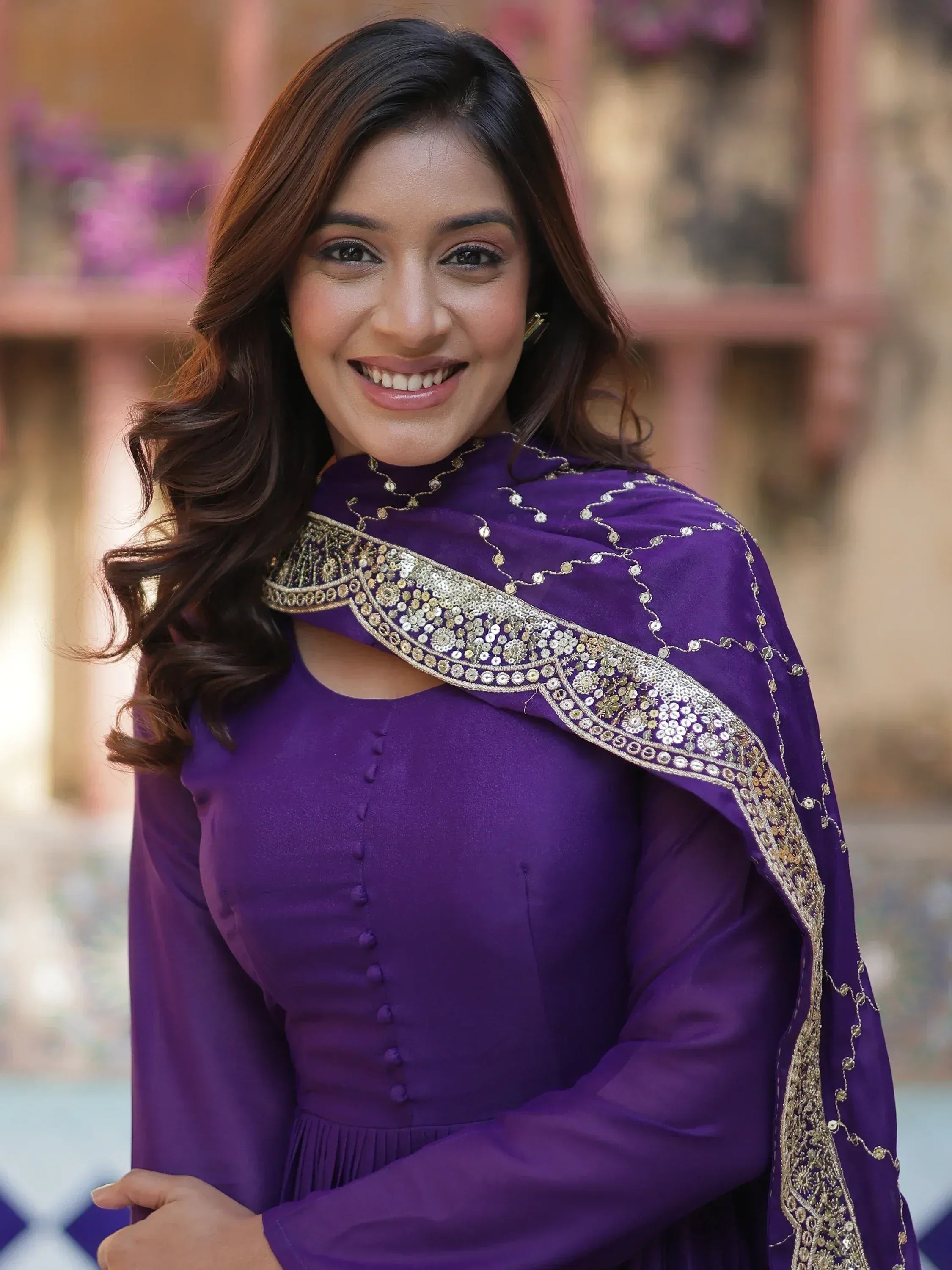 Purple ethnic gown with gold embroidery and sequin dupatta, perfect for Indian occasions