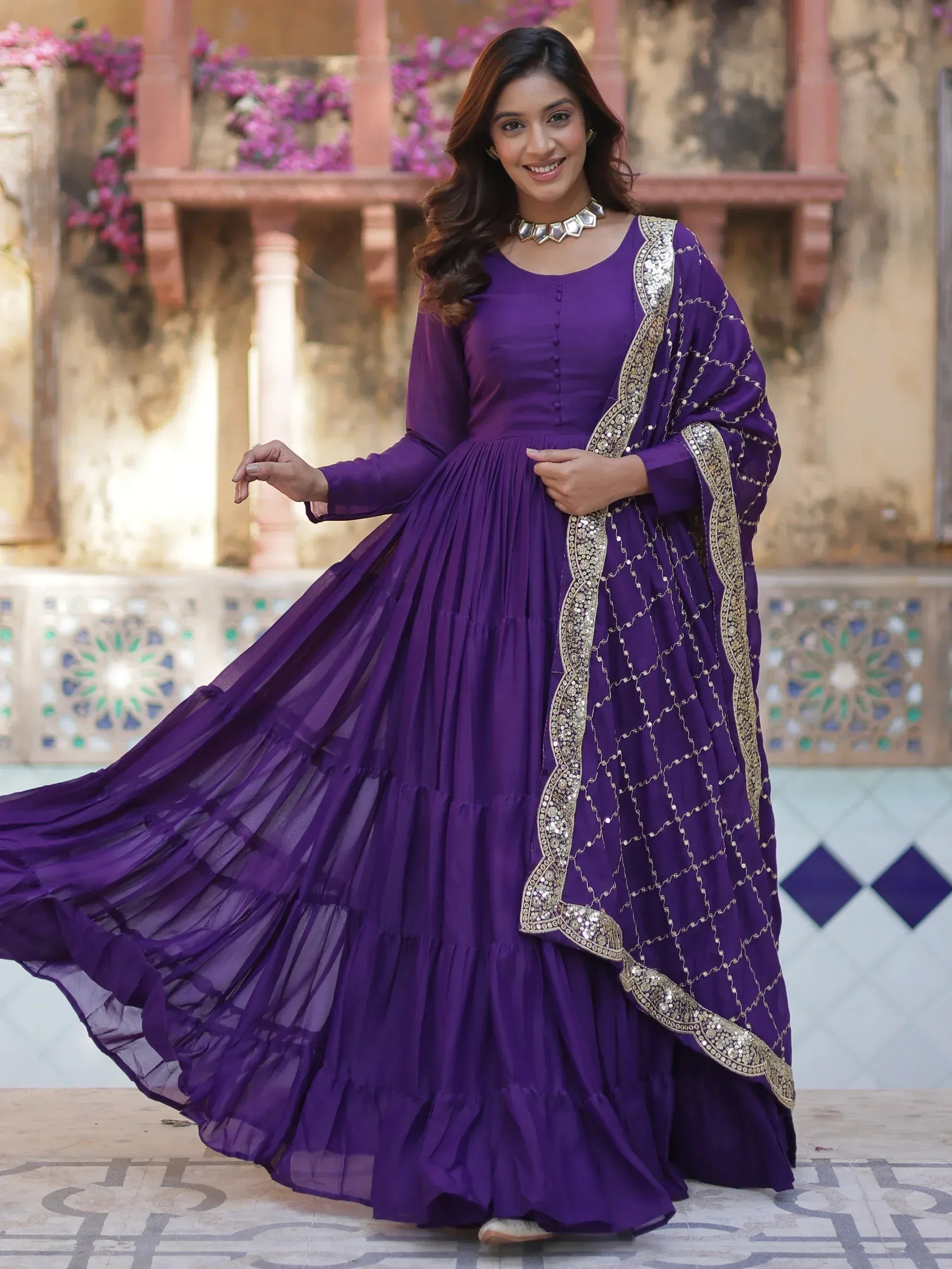 Purple ethnic gown with gold embroidery, perfect for Indian weddings and festive occasions