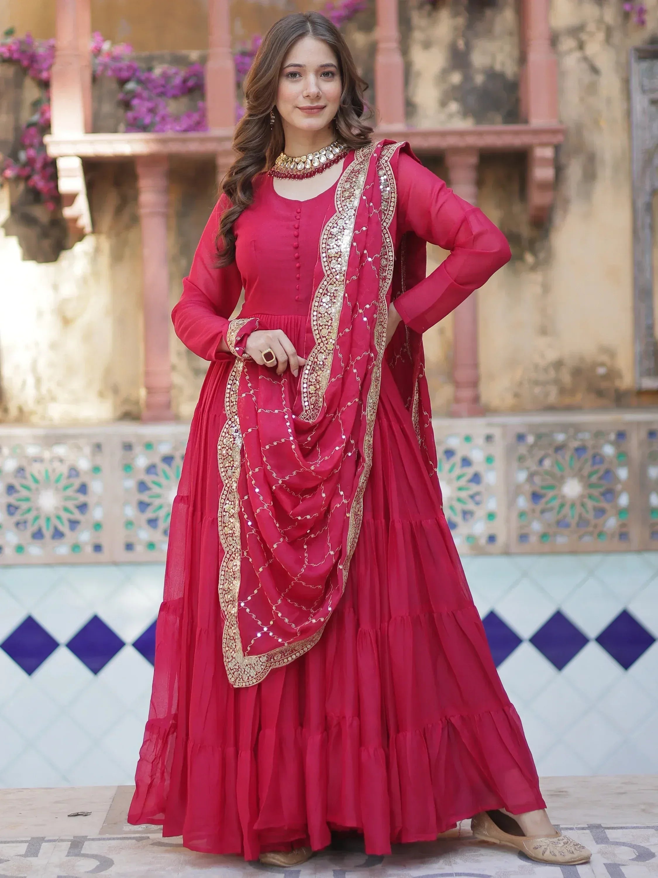 Red ethnic gown with gold embroidery, perfect for Indian weddings and festive occasions