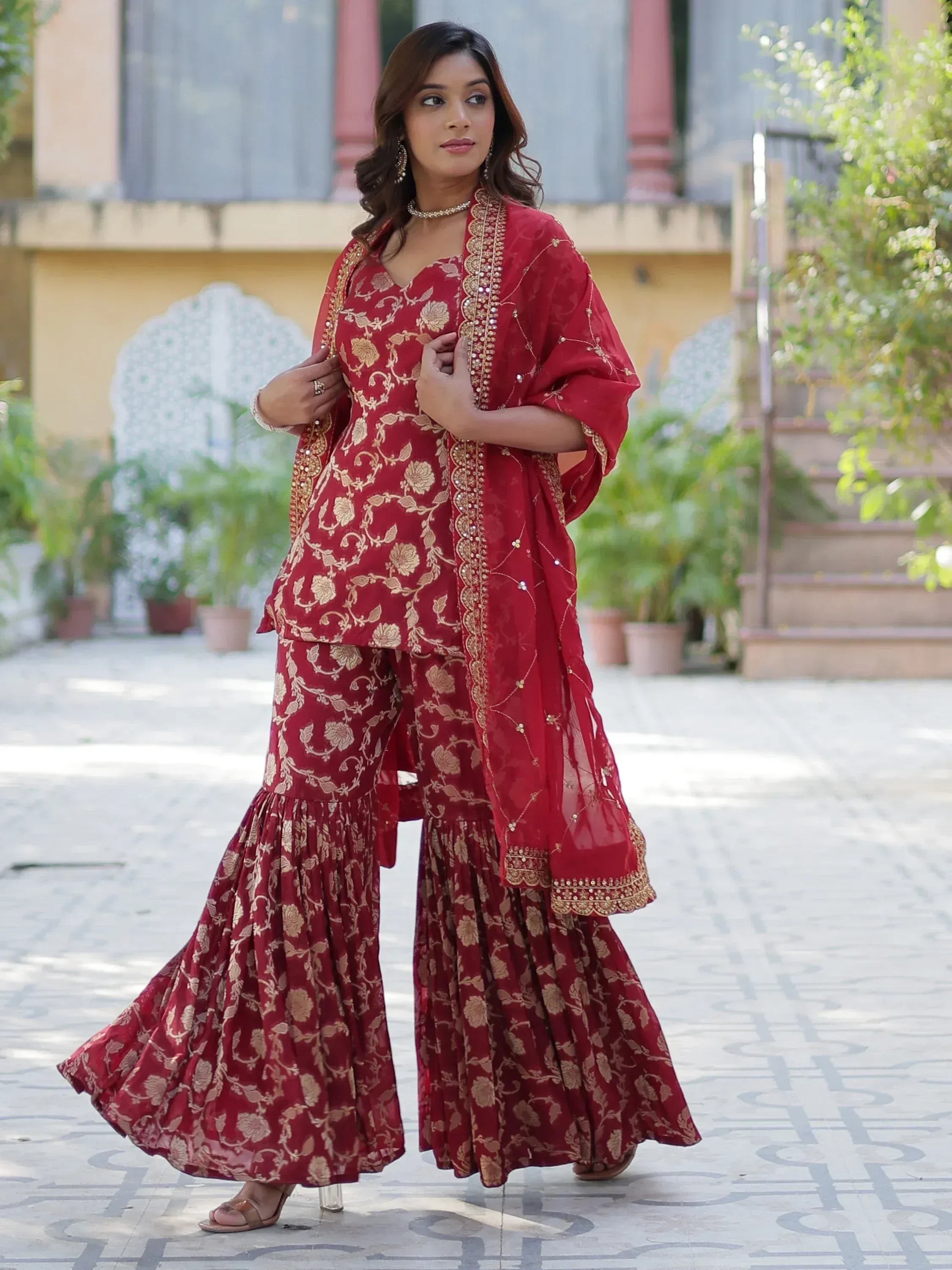 Red floral embroidered sharara suit with gold detailing, perfect for Indian ethnic occasions