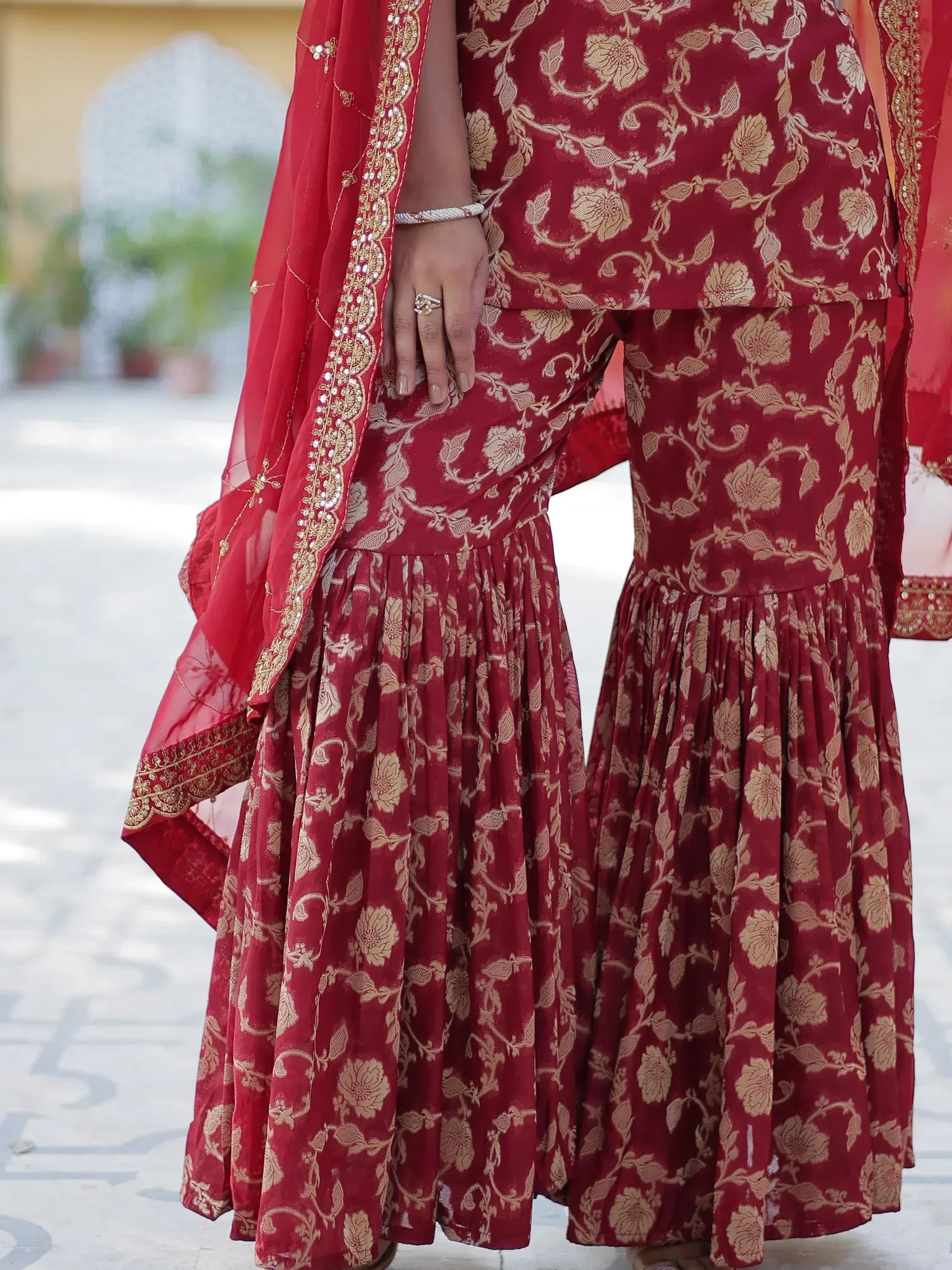 Red floral embroidered lehenga choli with golden detailing and dupatta