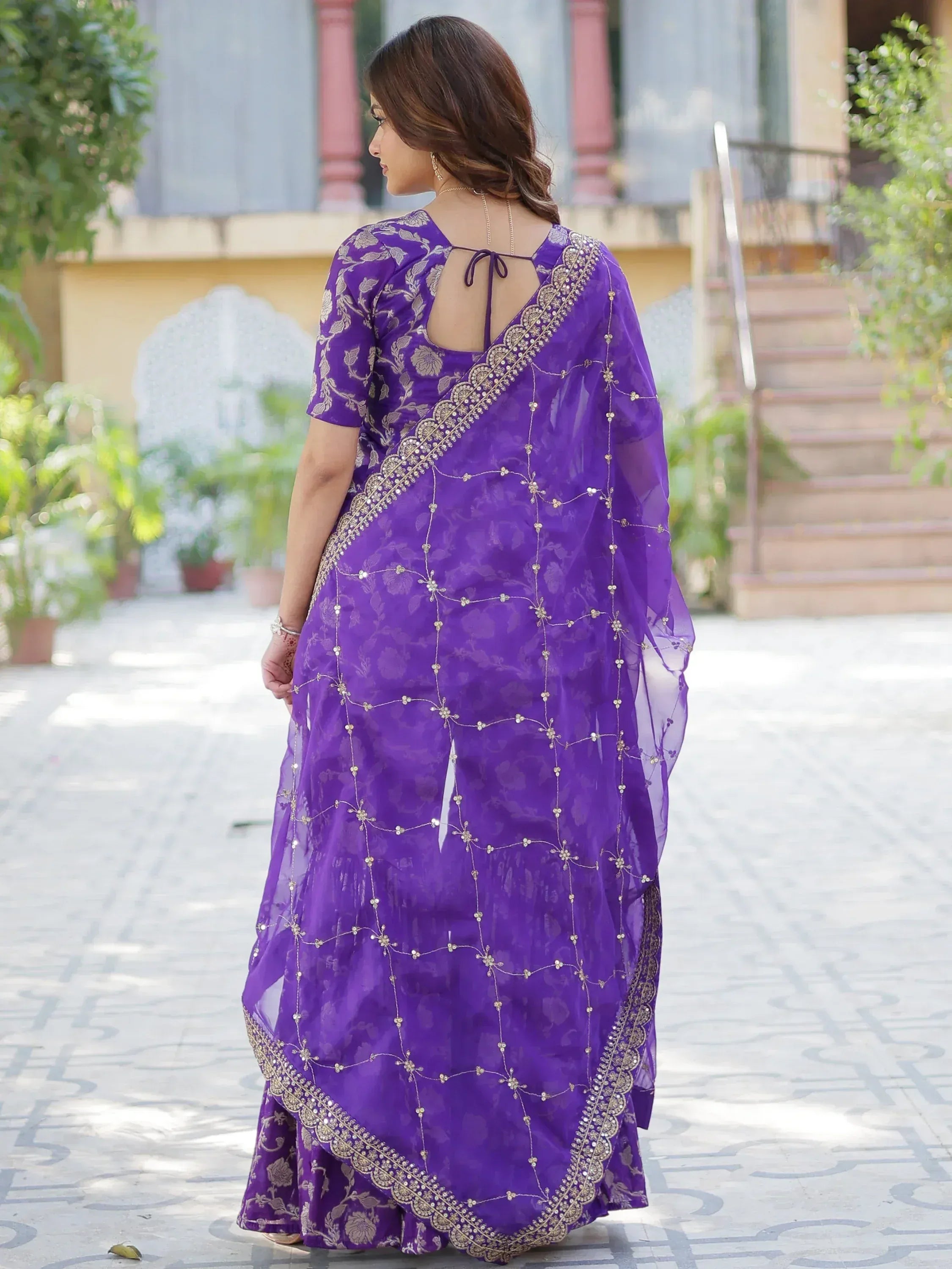 Purple embroidered saree with gold detailing, back view, floral pattern, ethnic wear