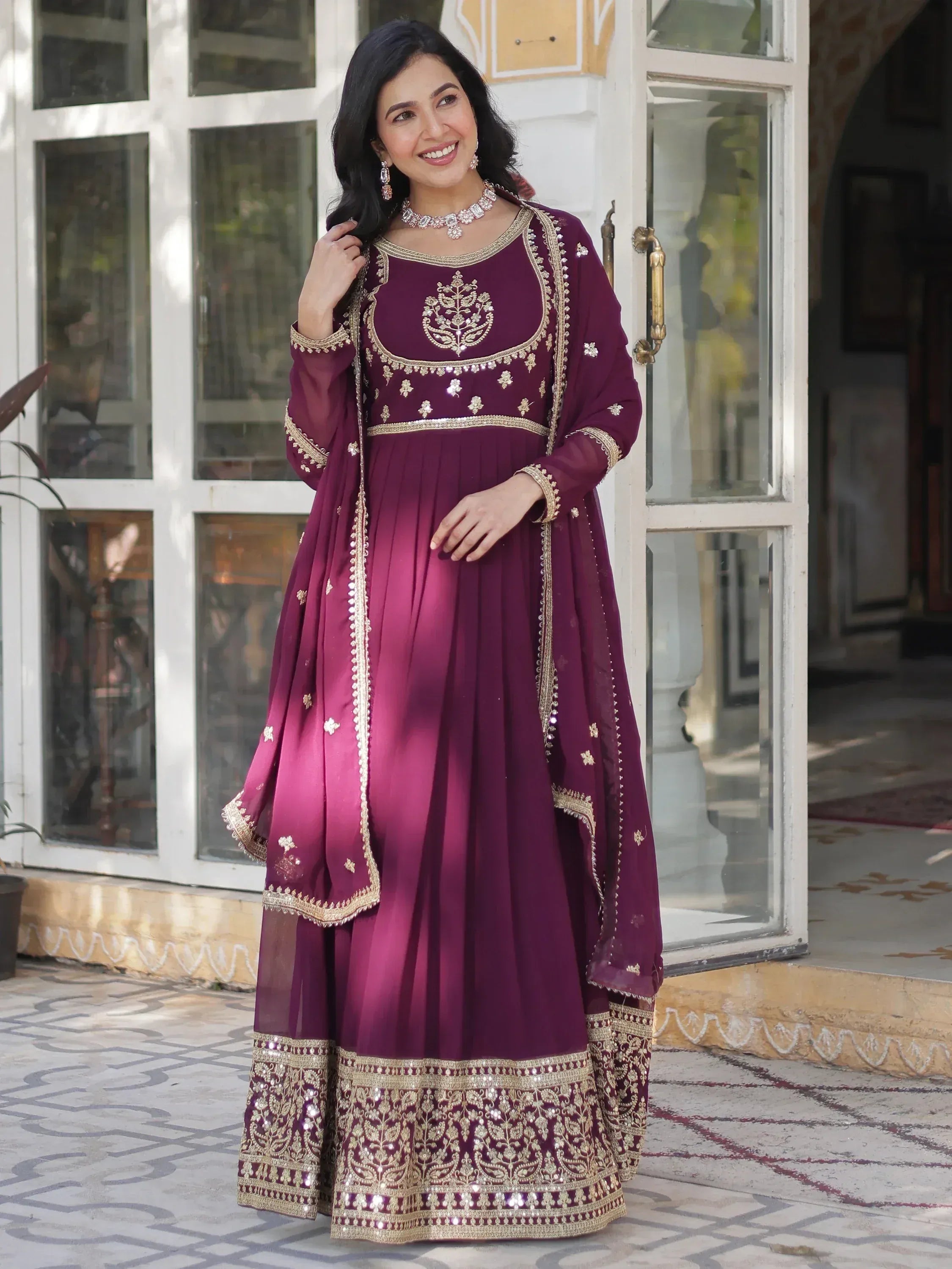 Elegant maroon anarkali suit with gold embroidery, perfect for Indian ethnic wear occasions