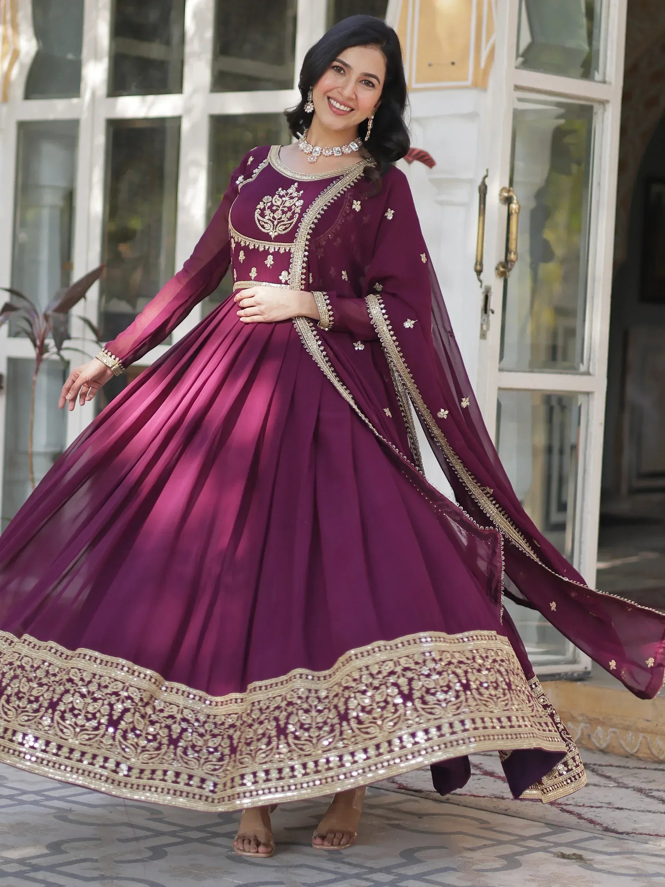 Elegant maroon designer anarkali with gold embroidery, perfect for Indian ethnic occasions