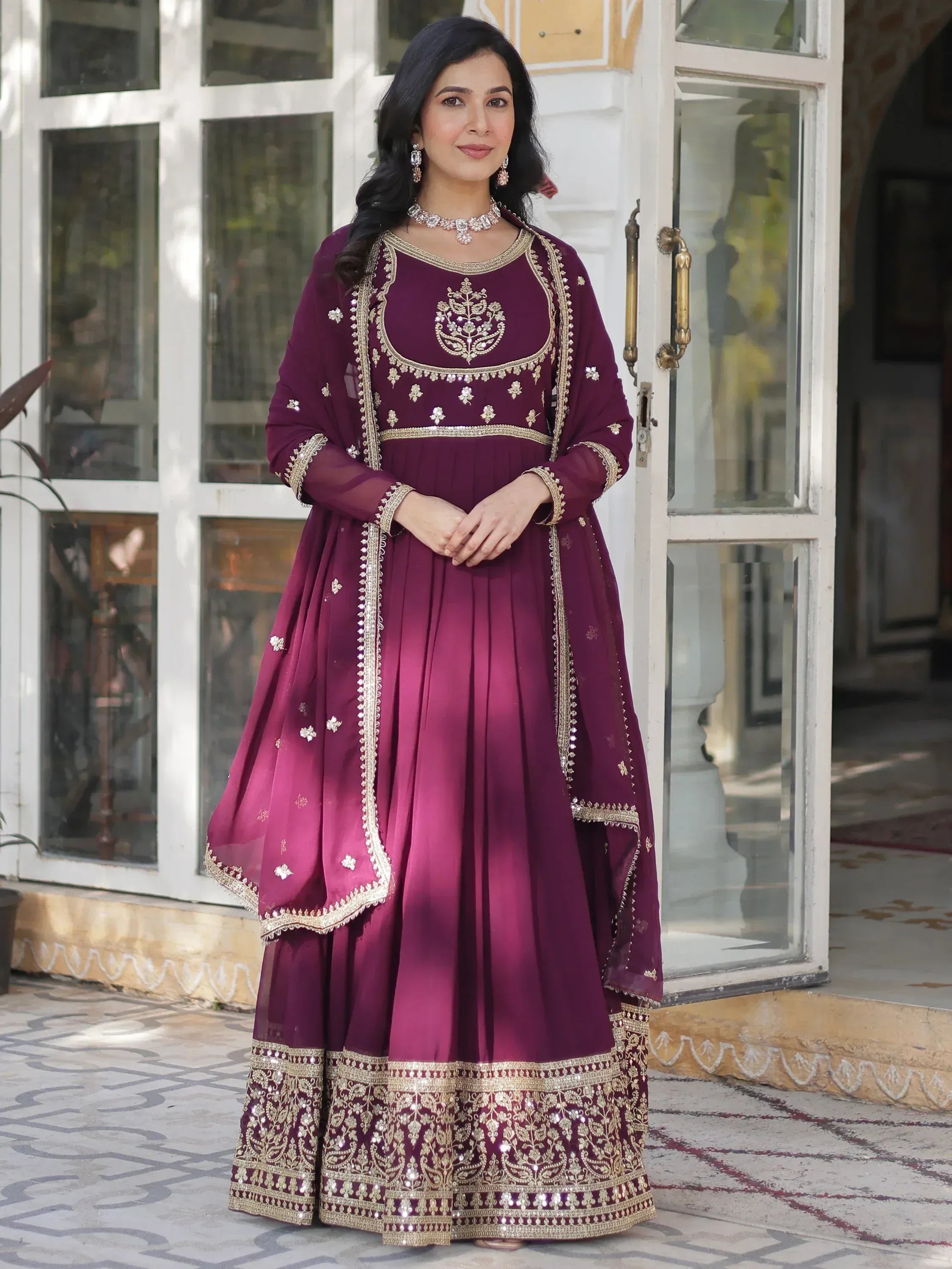 Elegant maroon anarkali suit with gold embroidery, perfect for Indian ethnic wear occasions.