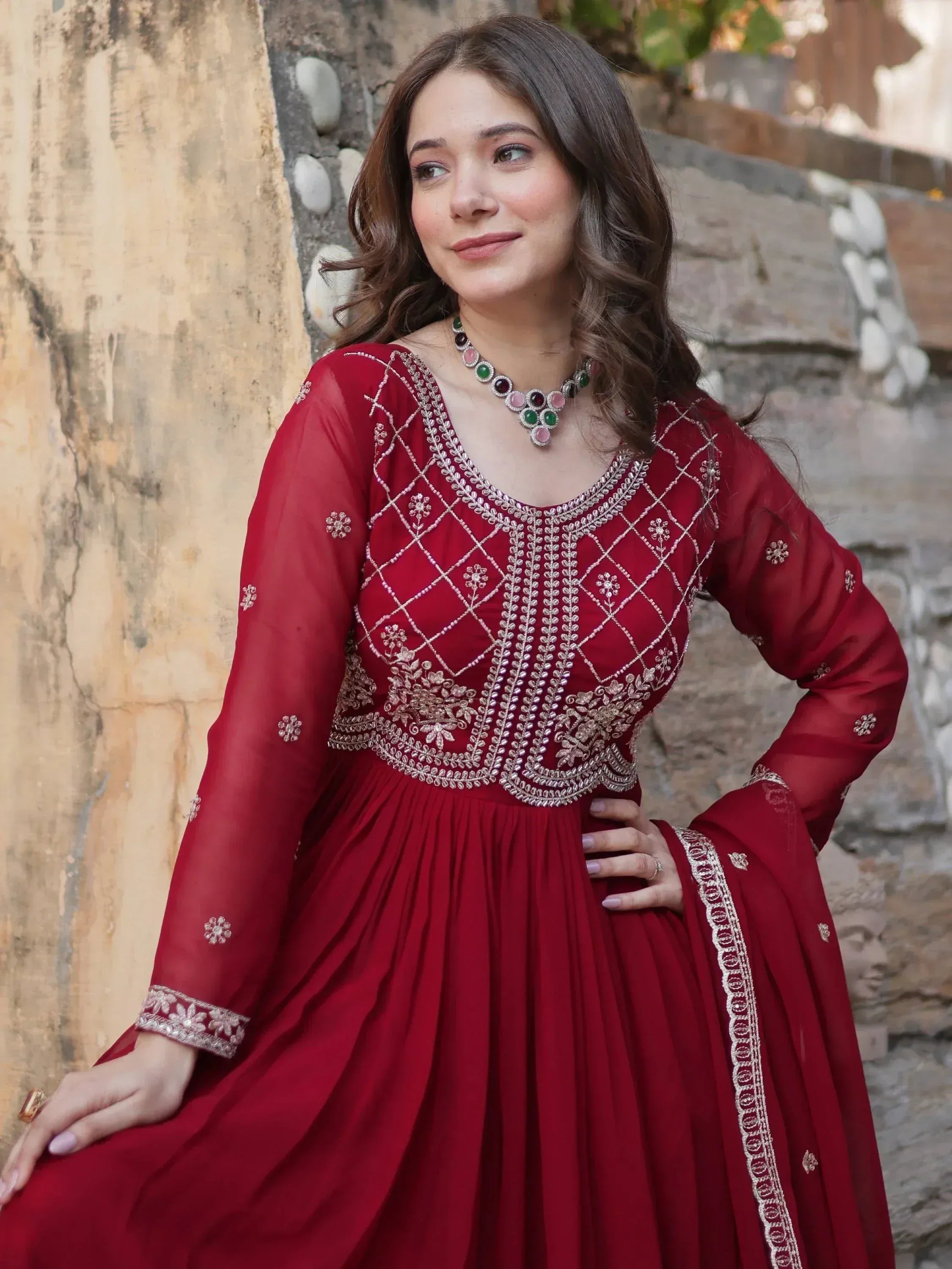 Red embroidered ethnic gown with floral detailing, perfect for Indian festive wear and special occasions.