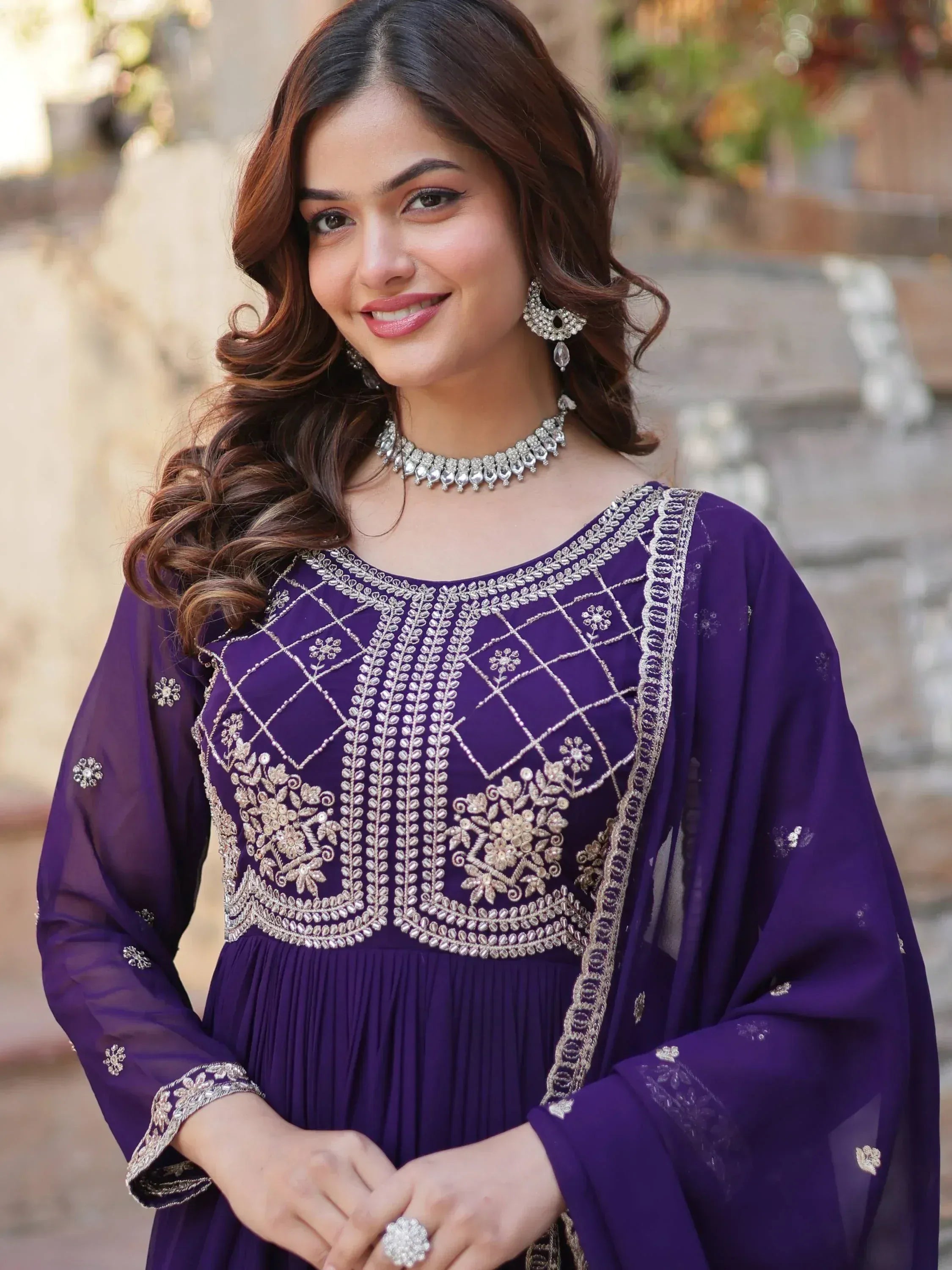 Purple embroidered ethnic gown with silver detailing, perfect for Indian festive occasions and weddings