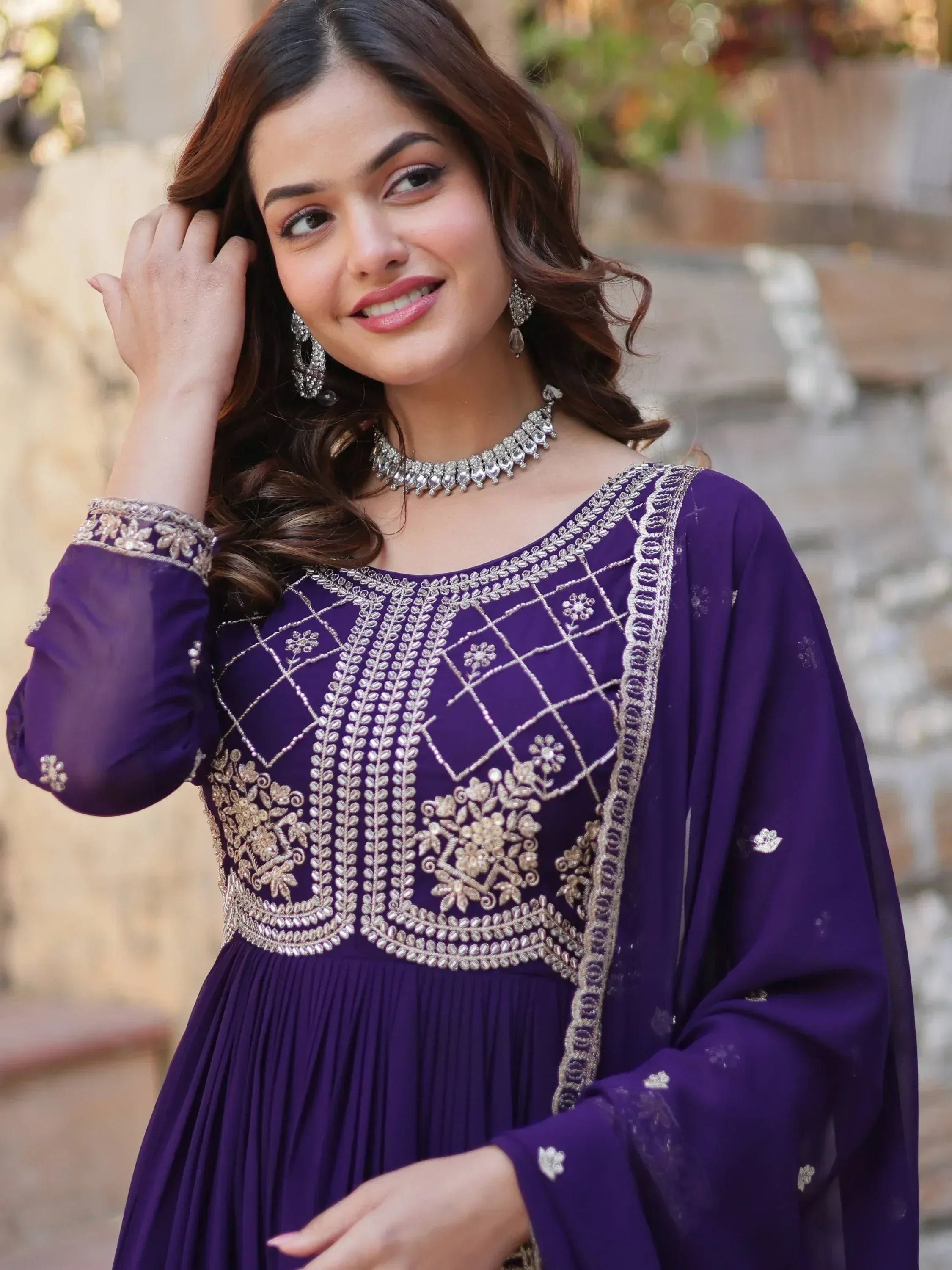 Purple embroidered ethnic gown with silver detailing, perfect for Indian festive wear and designer occasions.