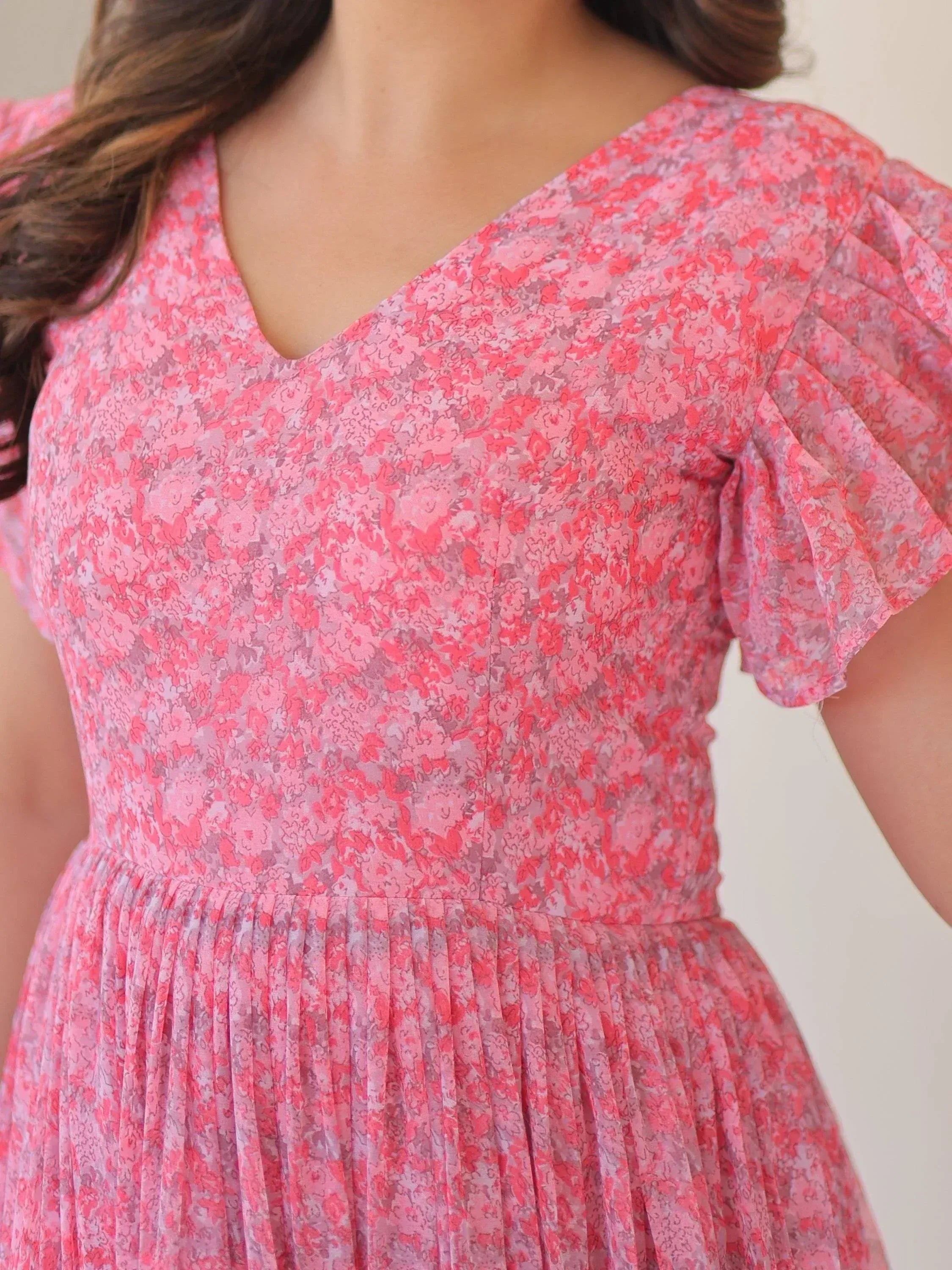 Pink floral ethnic gown with V-neck and ruffled sleeves, perfect for Indian occasions