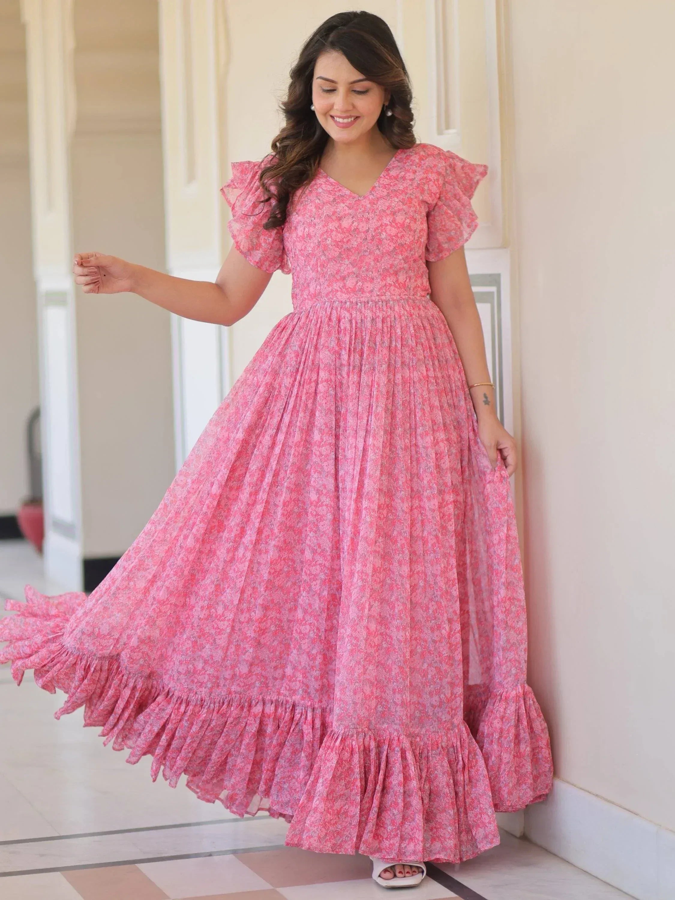 Pink floral ethnic gown with ruffled sleeves and tiered skirt for women