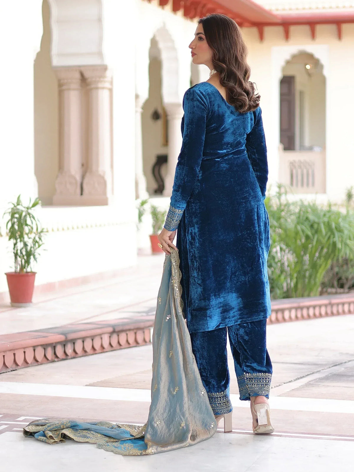 Blue velvet salwar kameez with gold embroidery, paired with matching dupatta, ideal for Indian ethnic wear