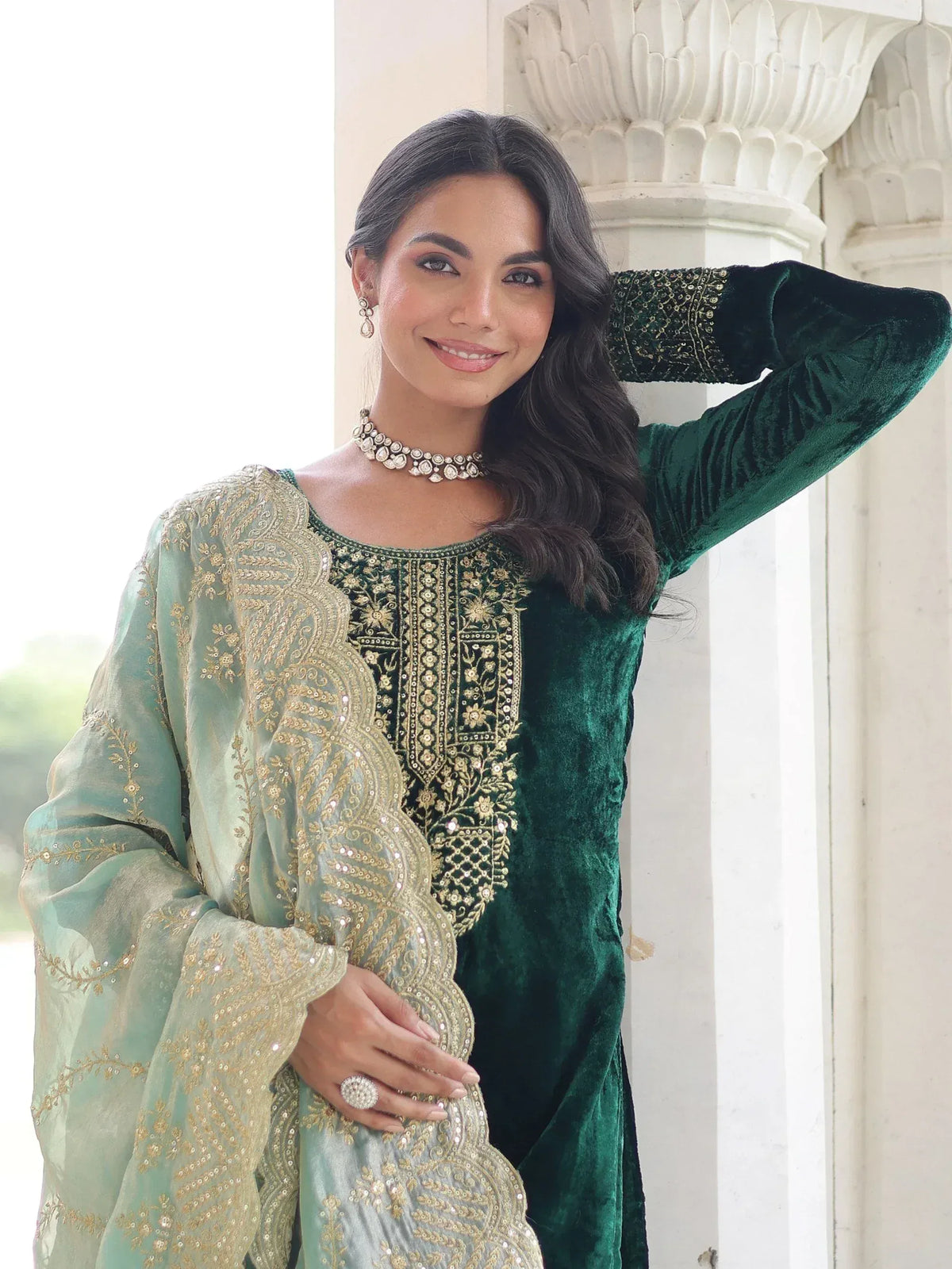 Emerald green velvet ethnic kurta with gold embroidery, paired with sheer mint dupatta for festive occasions