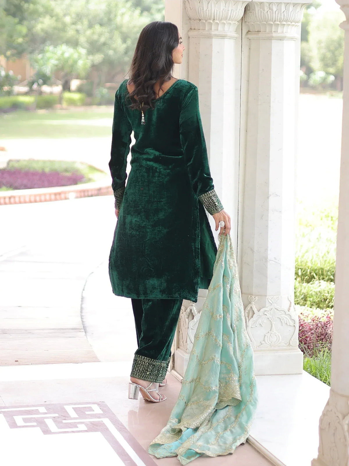 Emerald green velvet salwar kameez with gold embroidery, paired with mint dupatta, perfect for Indian ethnic wear occasions.