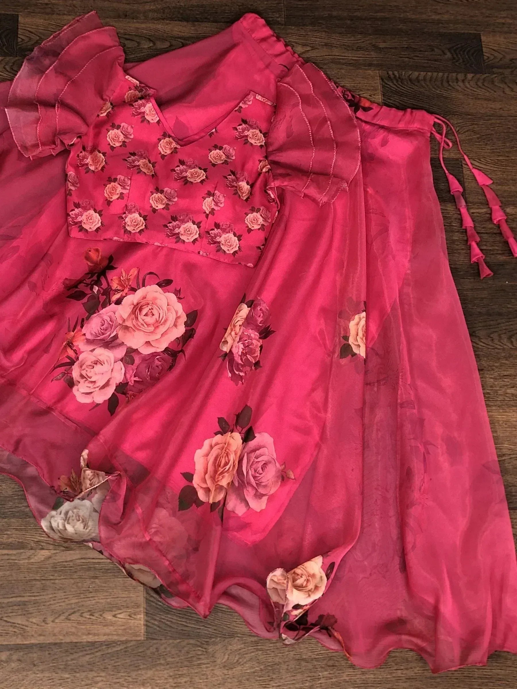 Pink floral print ethnic gown with ruffled sleeves and matching dupatta, perfect for Indian occasions