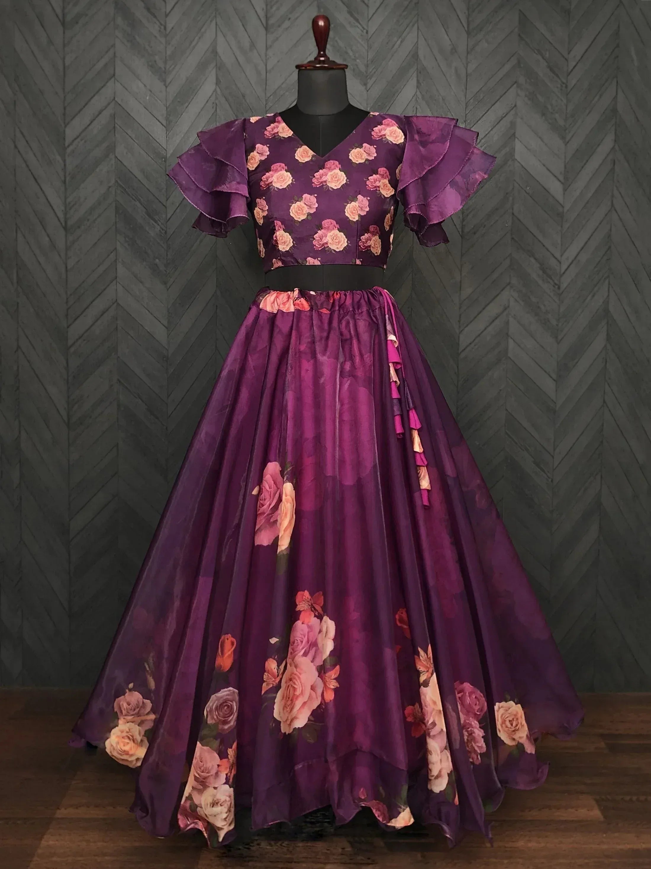 Purple floral ethnic gown with ruffled sleeves and flared skirt, perfect for Indian occasions