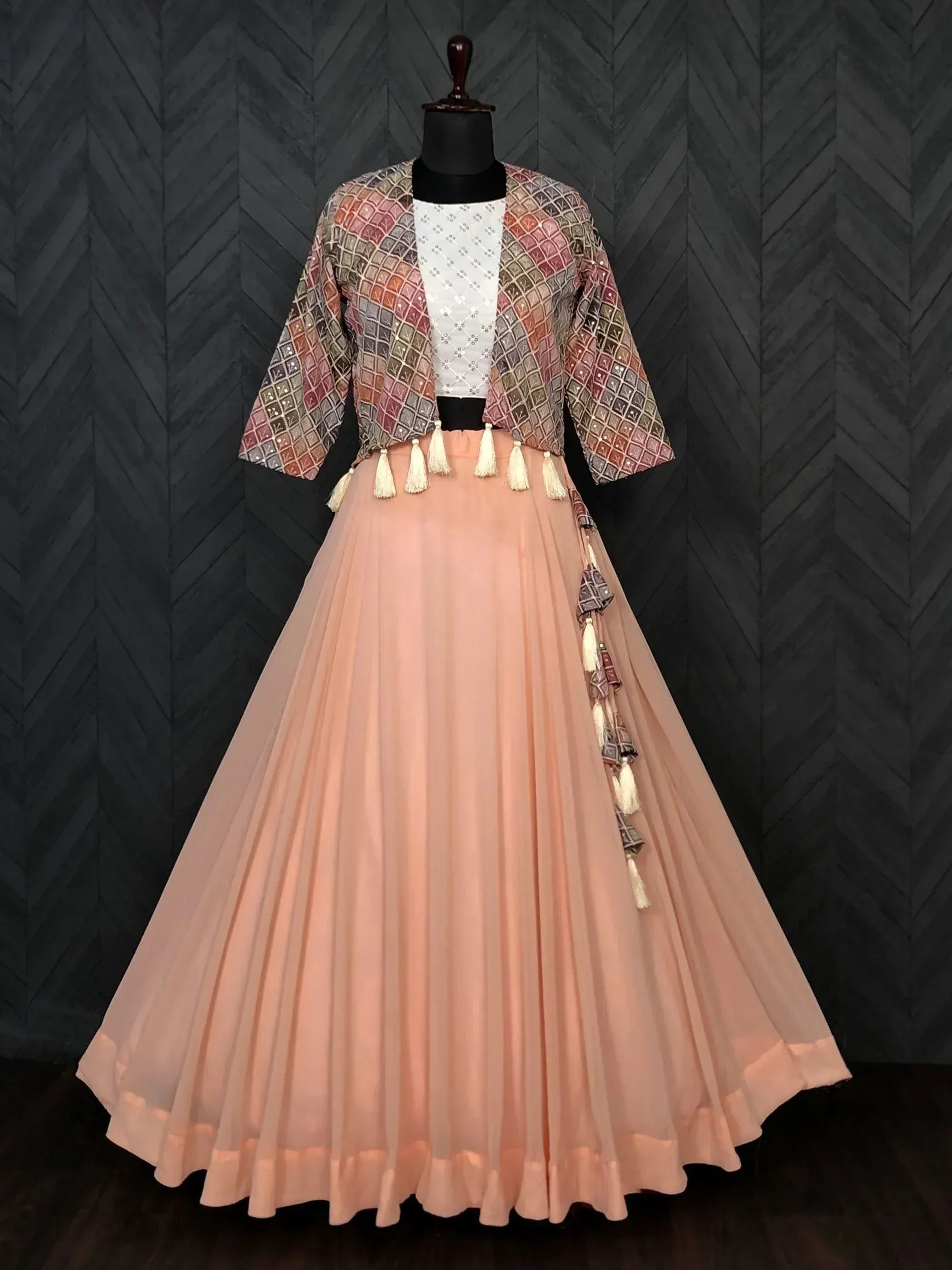 Pink pleated skirt with patterned jacket and tassels, Indian ethnic wear