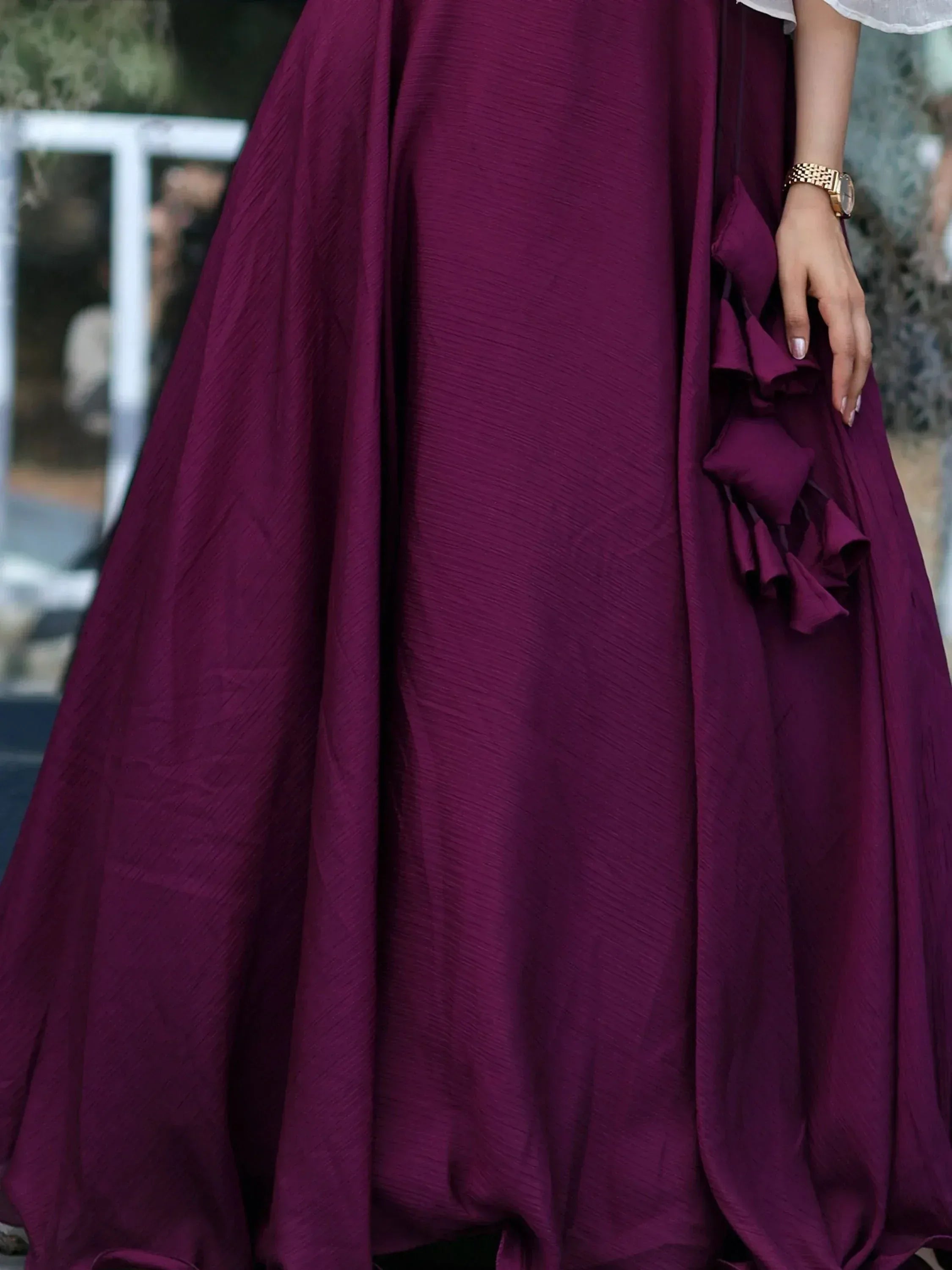 Elegant maroon ethnic gown with ruffle details, perfect for Indian occasions