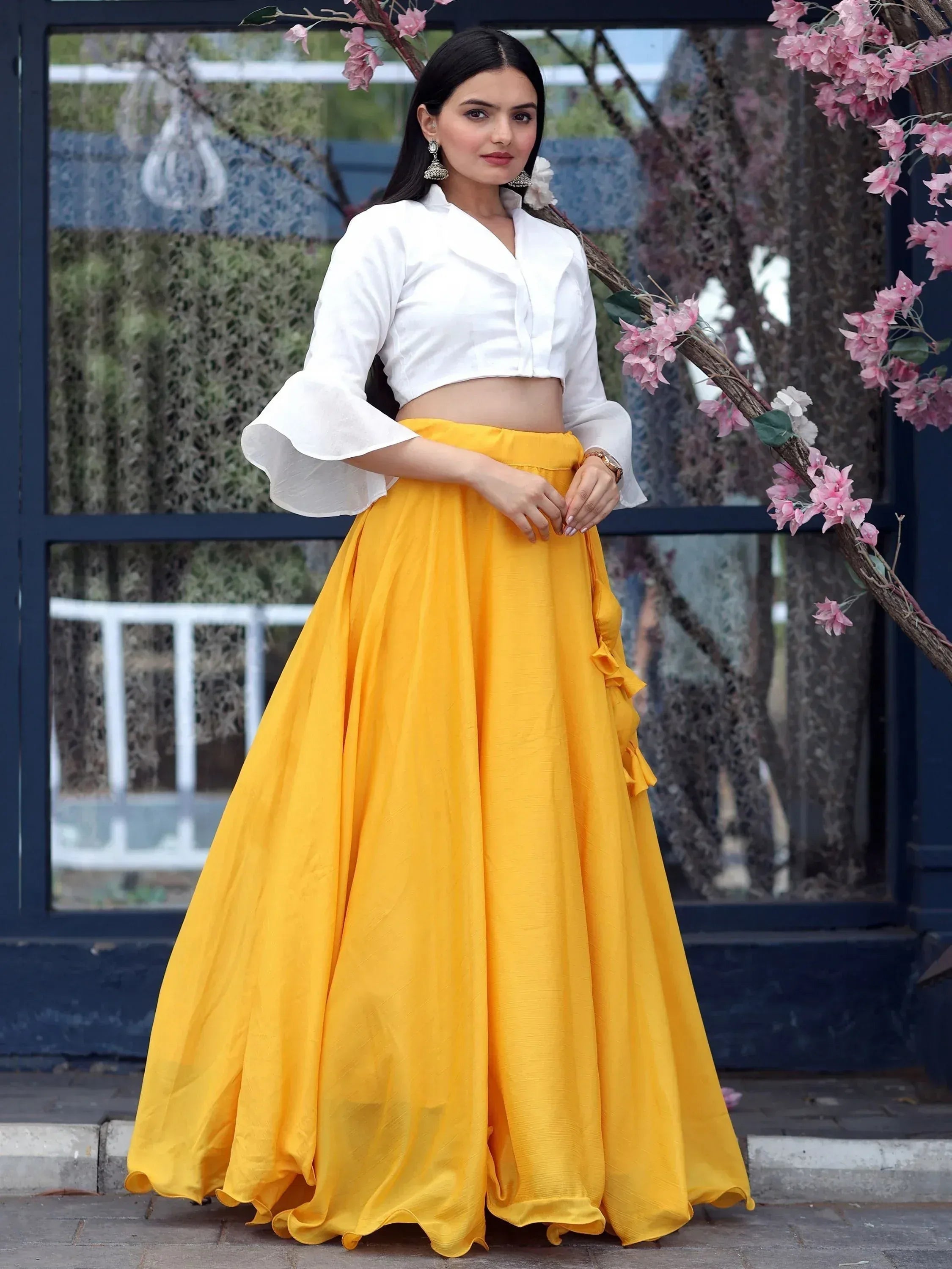 Yellow lehenga with white crop top, flared skirt, bell sleeves, perfect for Indian ethnic wear occasions