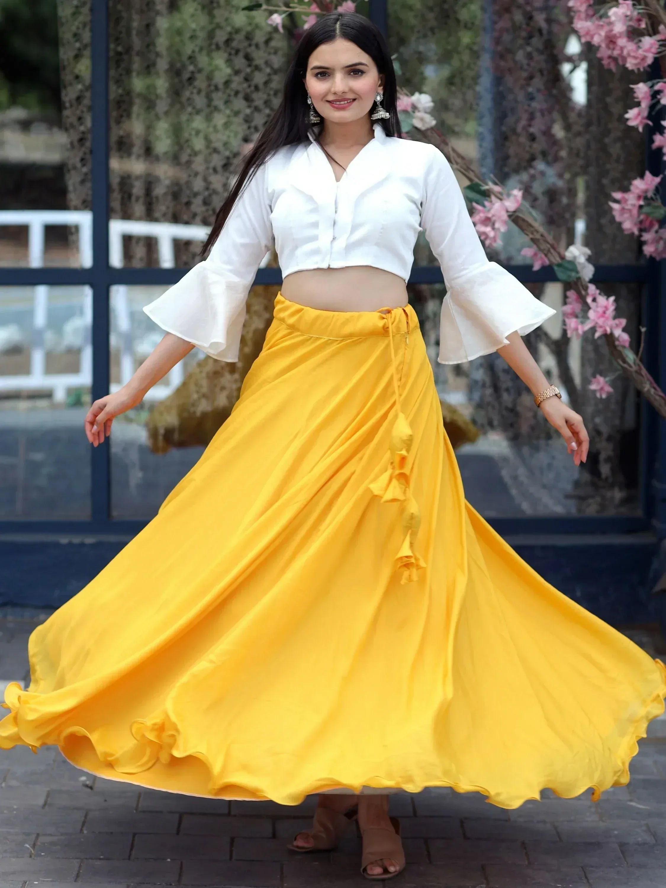 Yellow flared skirt with white crop top, perfect for ethnic wear styling