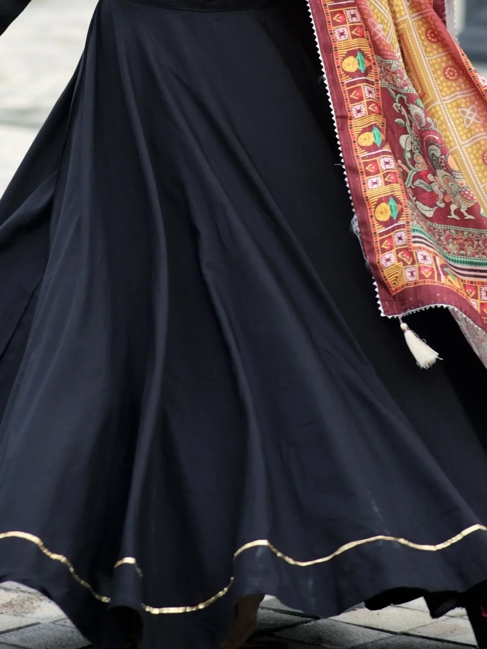Black ethnic skirt with gold trim and colorful printed dupatta, perfect for Indian wear