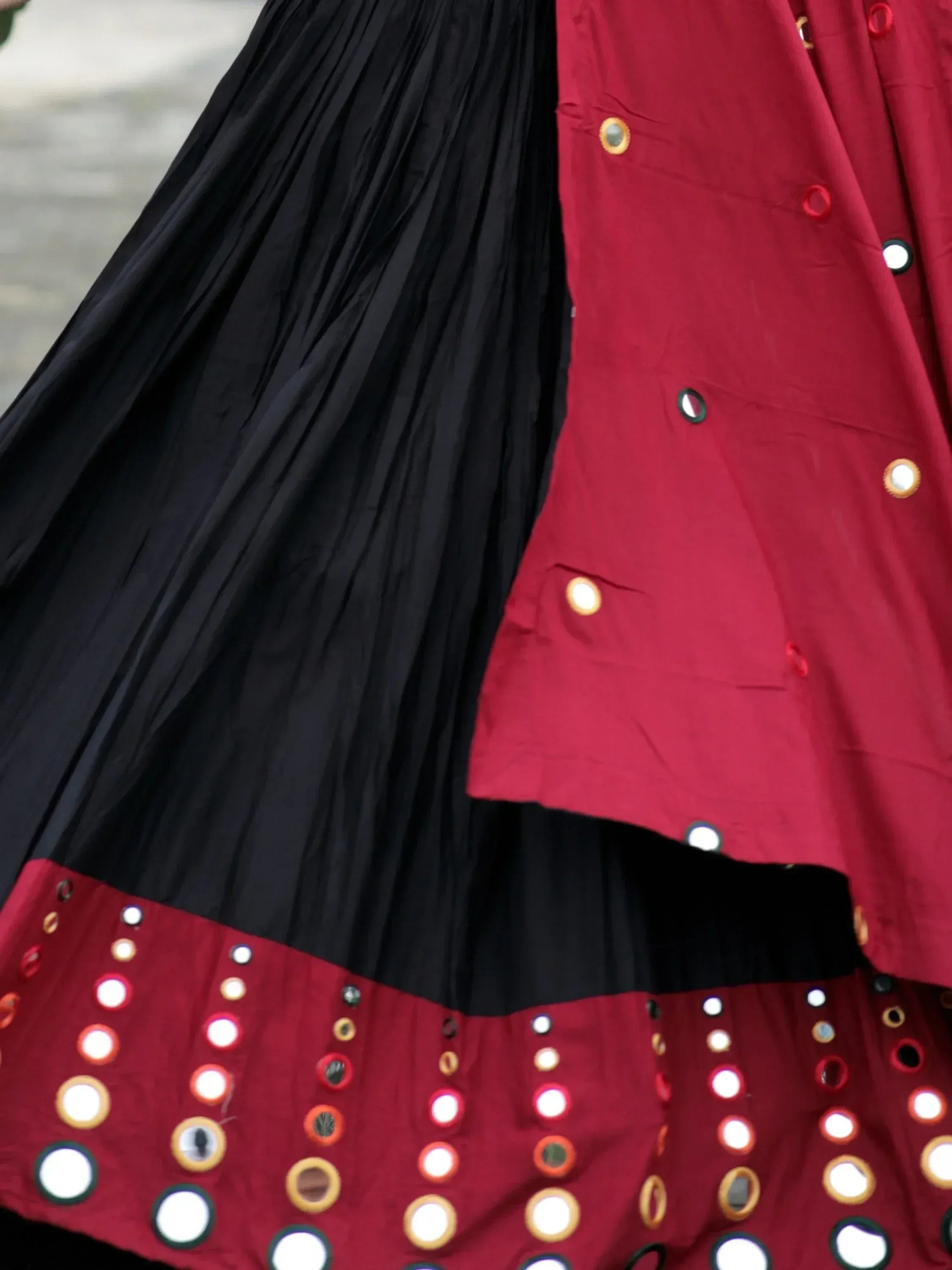 Black and red ethnic lehenga with mirror work and pleated skirt, perfect for festive occasions