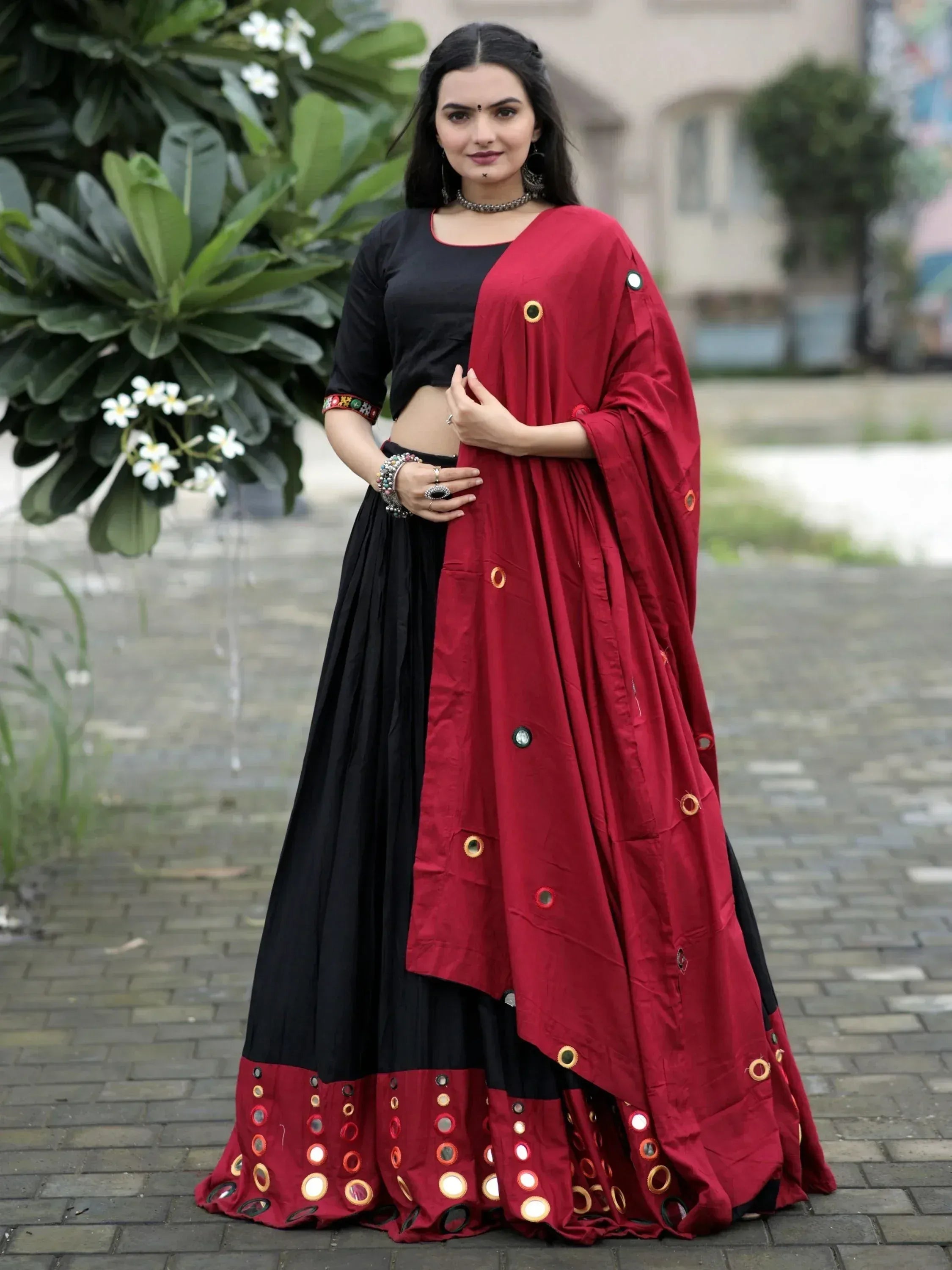Black and maroon lehenga choli with mirror work, perfect for Indian ethnic wear and festive occasions.