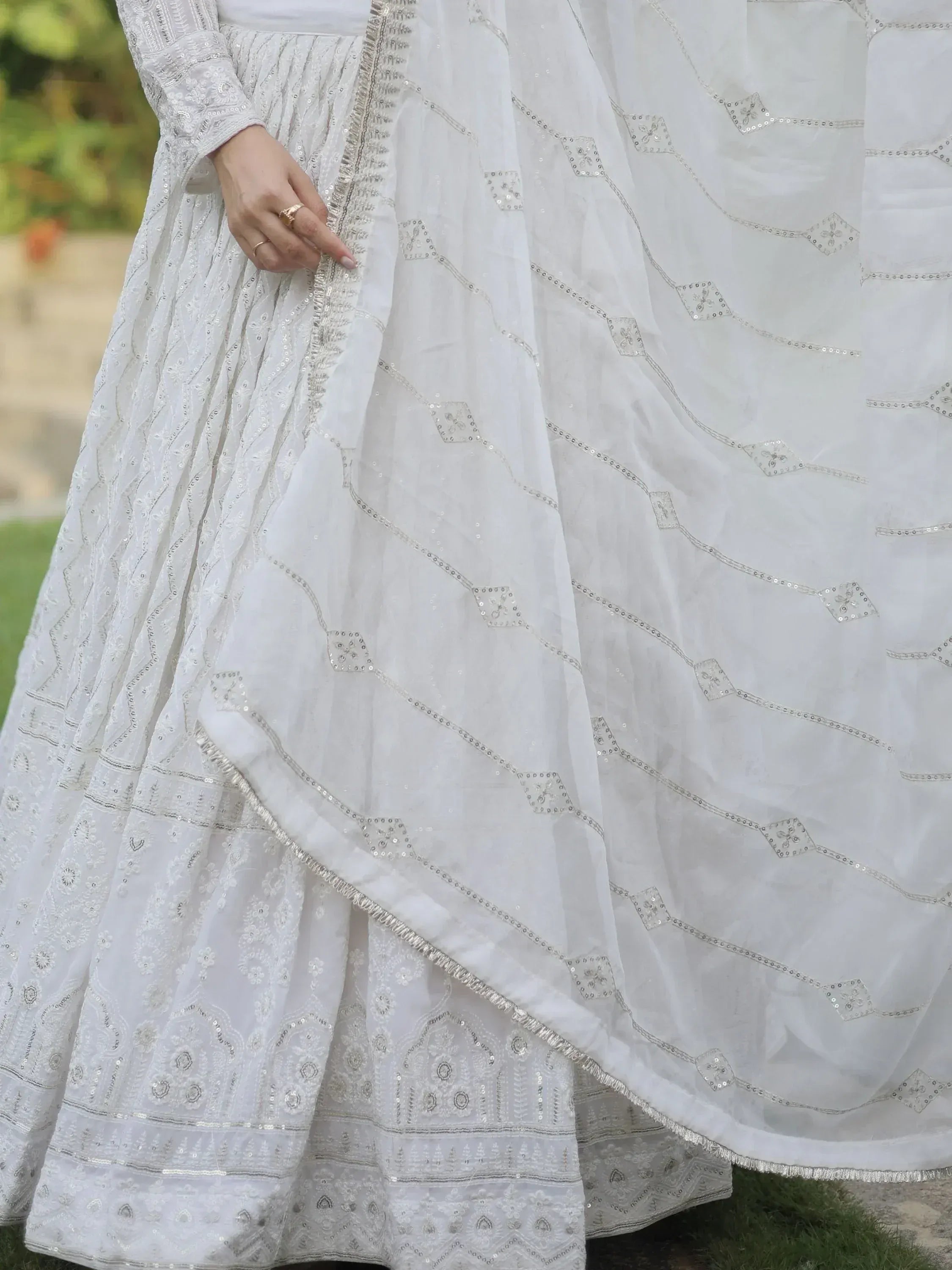 White embroidered lehenga choli with sequin detailing, perfect for Indian ethnic wear occasions