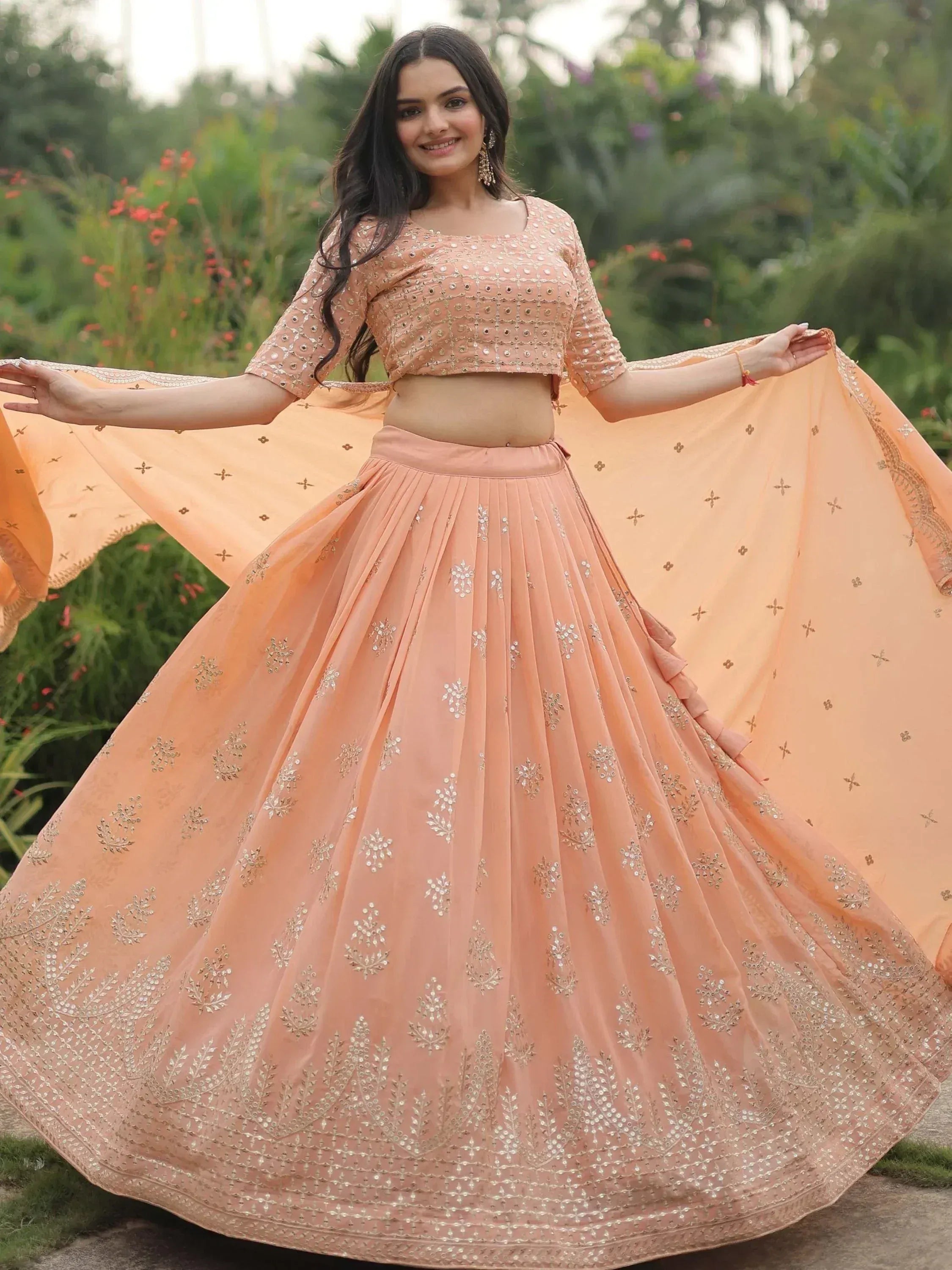 Peach designer lehenga choli with gold embroidery, perfect for Indian ethnic wear events