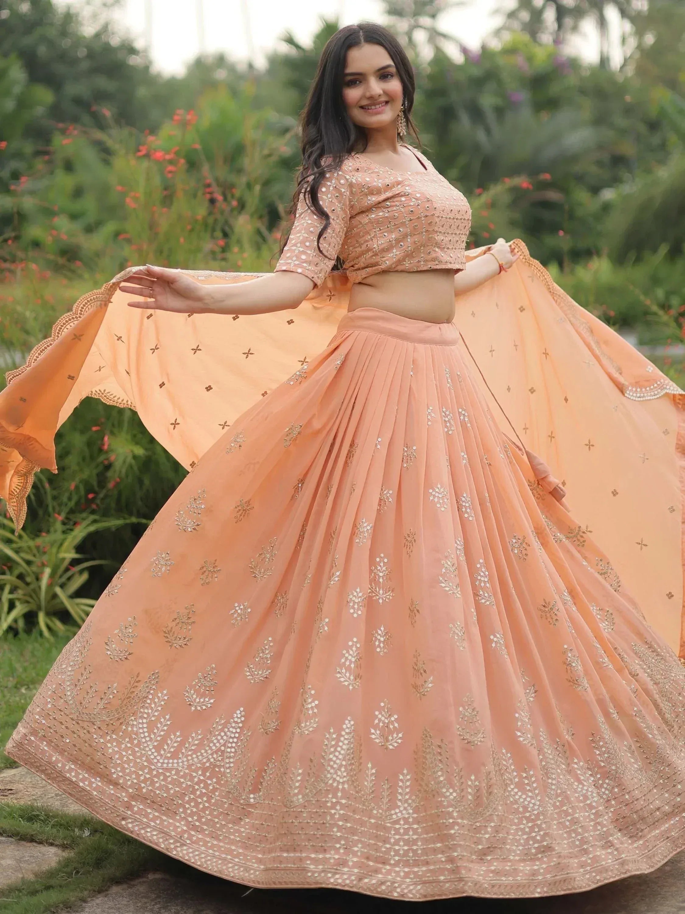 Peach designer lehenga choli with floral embroidery, perfect for Indian ethnic wear occasions