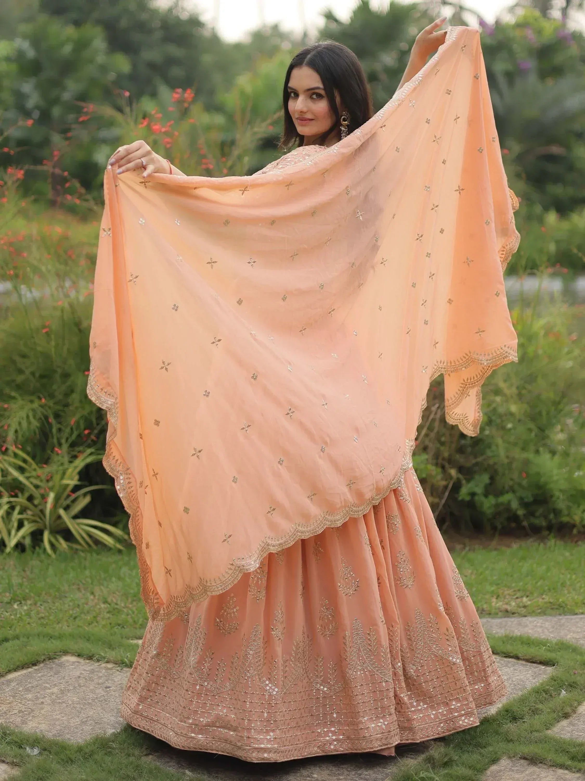 Peach designer lehenga choli with gold embroidery, perfect for Indian ethnic wear occasions