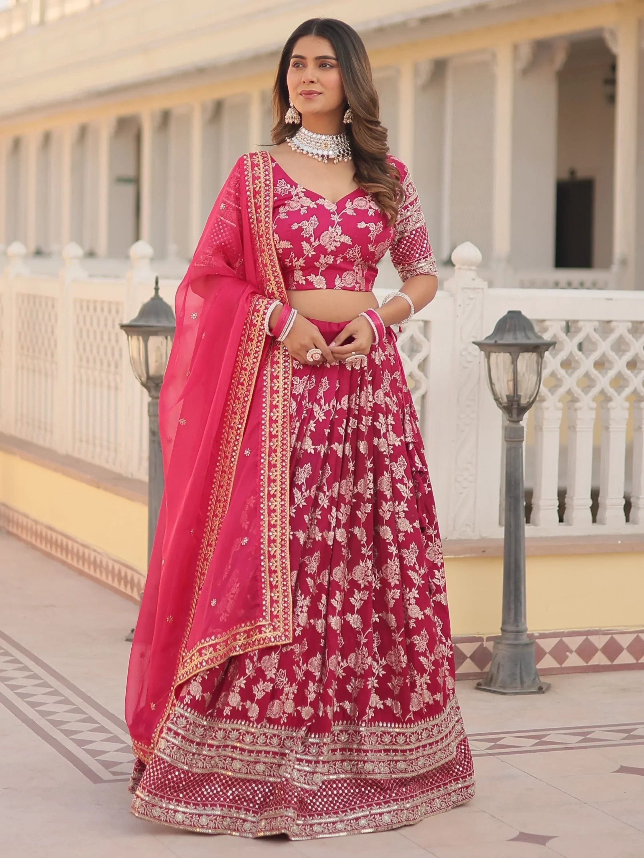 Pink floral embroidered lehenga choli with dupatta, perfect for Indian weddings and festive occasions