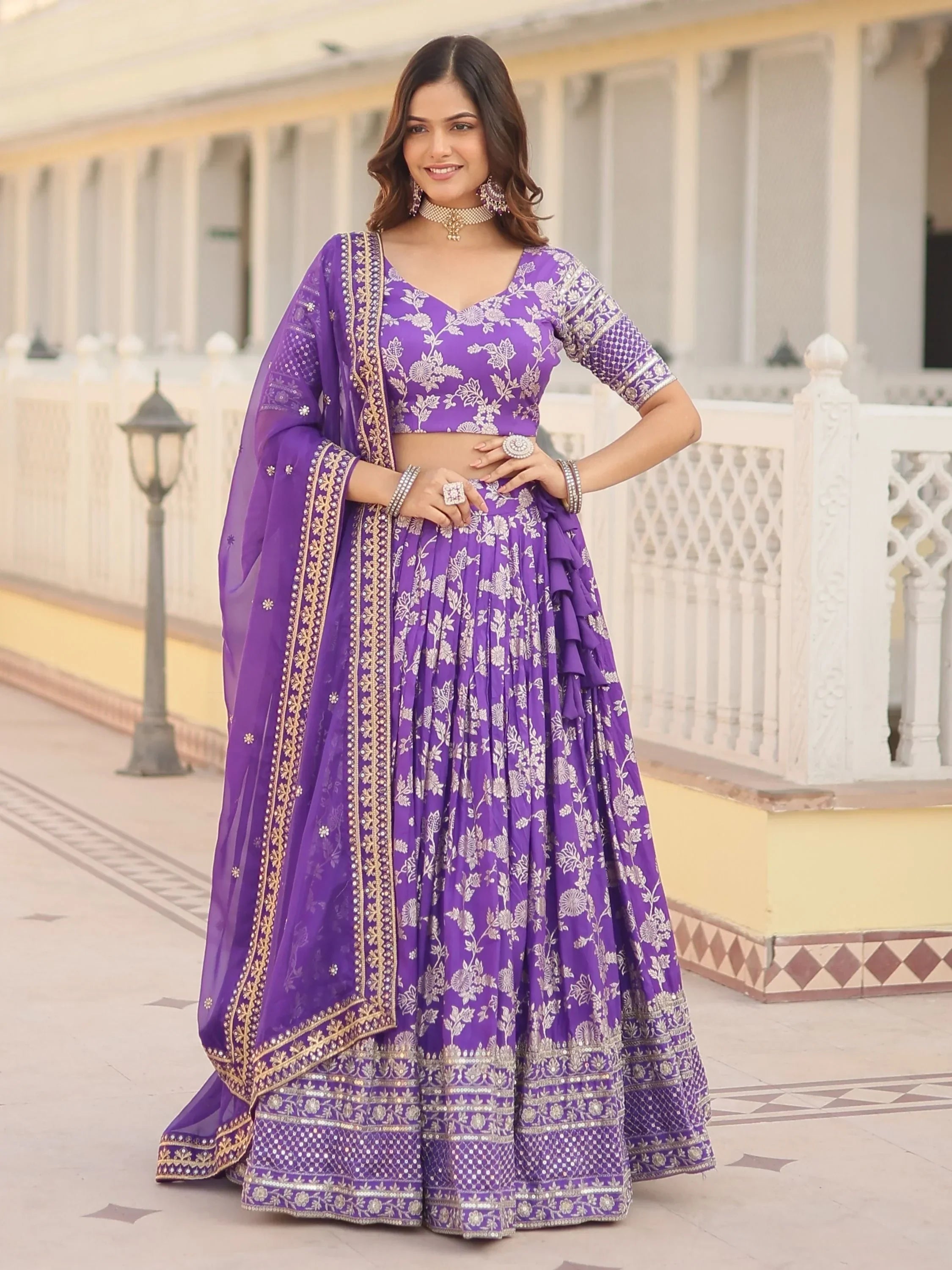 Purple floral embroidered lehenga choli with gold detailing, perfect for Indian weddings and festive occasions