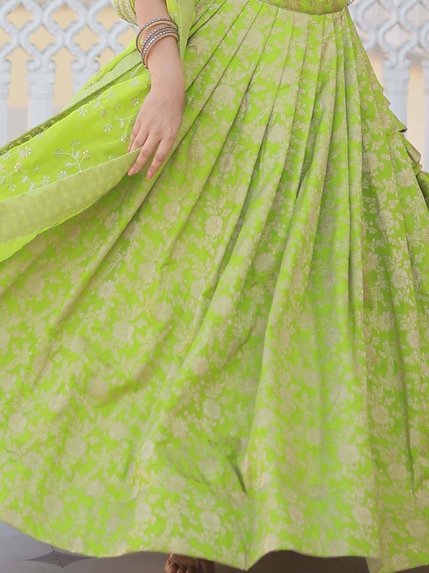 Vibrant green lehenga with gold floral print and pleated skirt, perfect for Indian ethnic wear occasions.