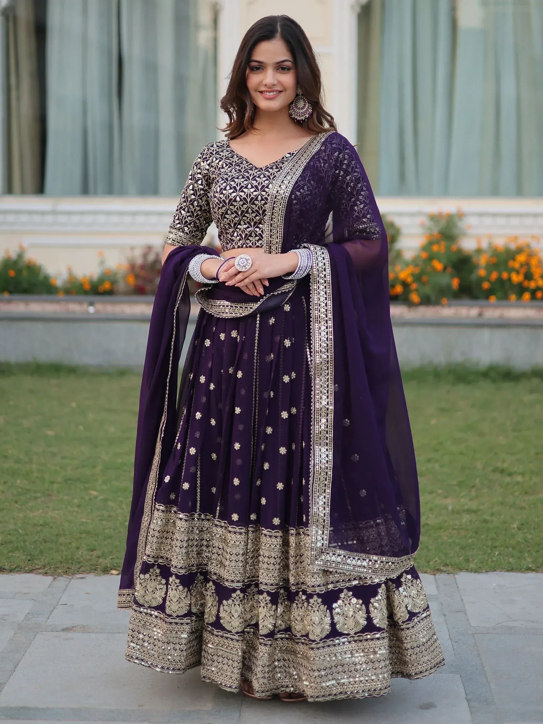 Elegant purple embroidered anarkali suit with gold detailing, perfect for Indian ethnic occasions.