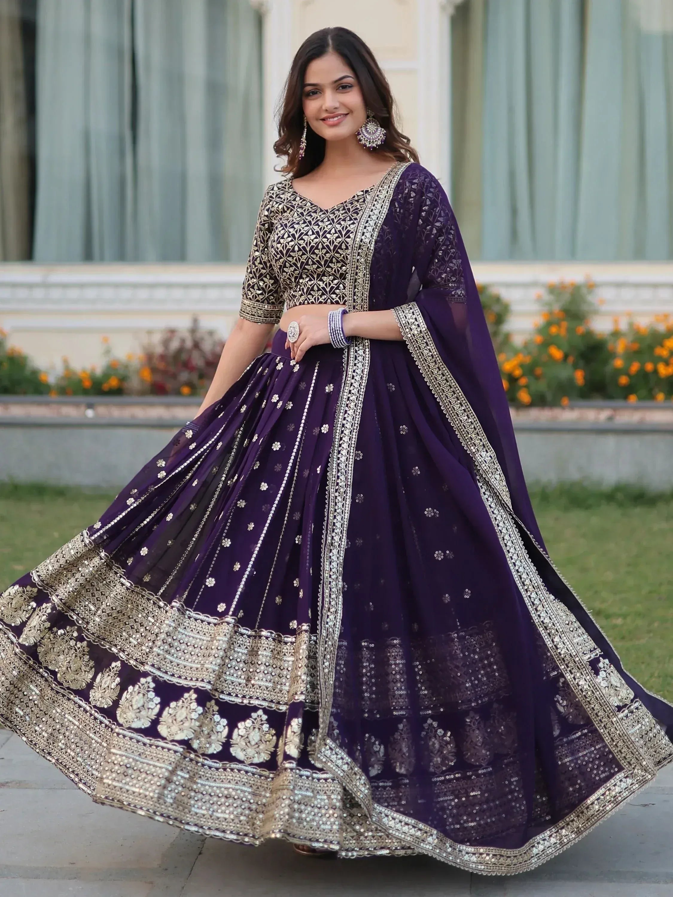 Purple designer lehenga choli with gold embroidery, perfect for Indian weddings and festive occasions
