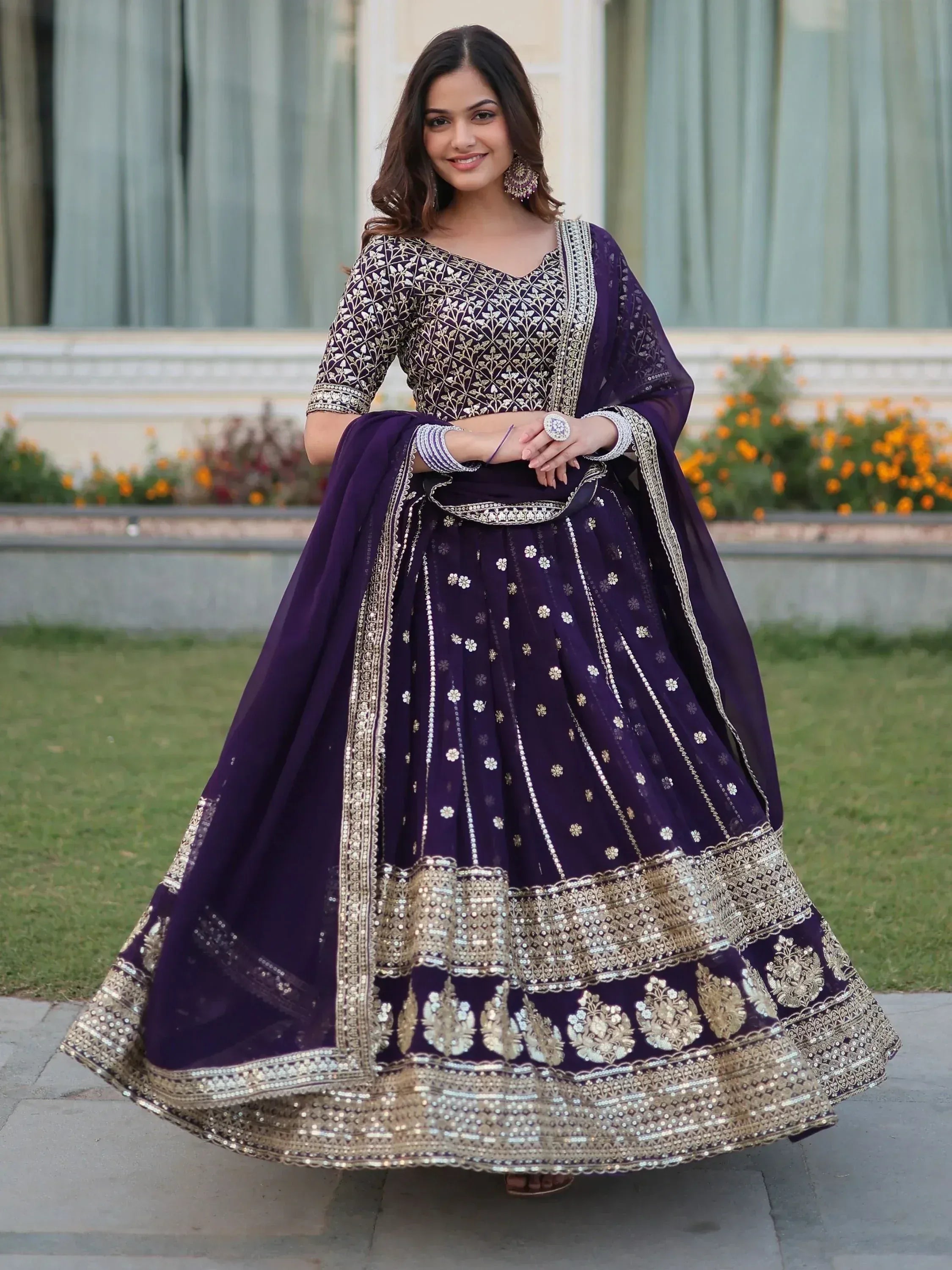 Purple designer lehenga choli with gold embroidery, perfect for Indian weddings and festive occasions