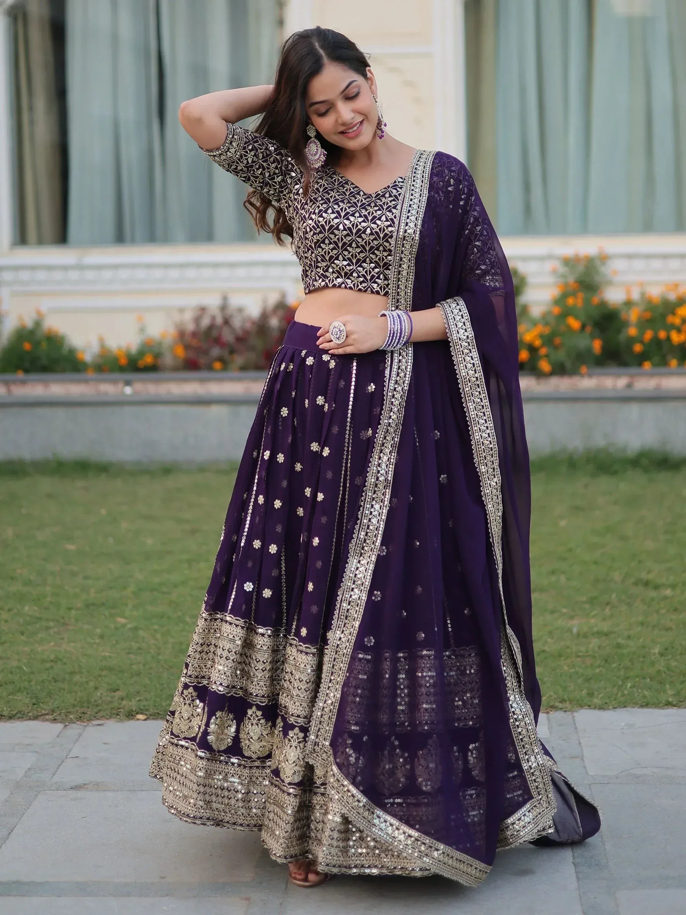 Purple designer lehenga choli with gold embroidery, perfect for Indian ethnic wear and festive occasions.